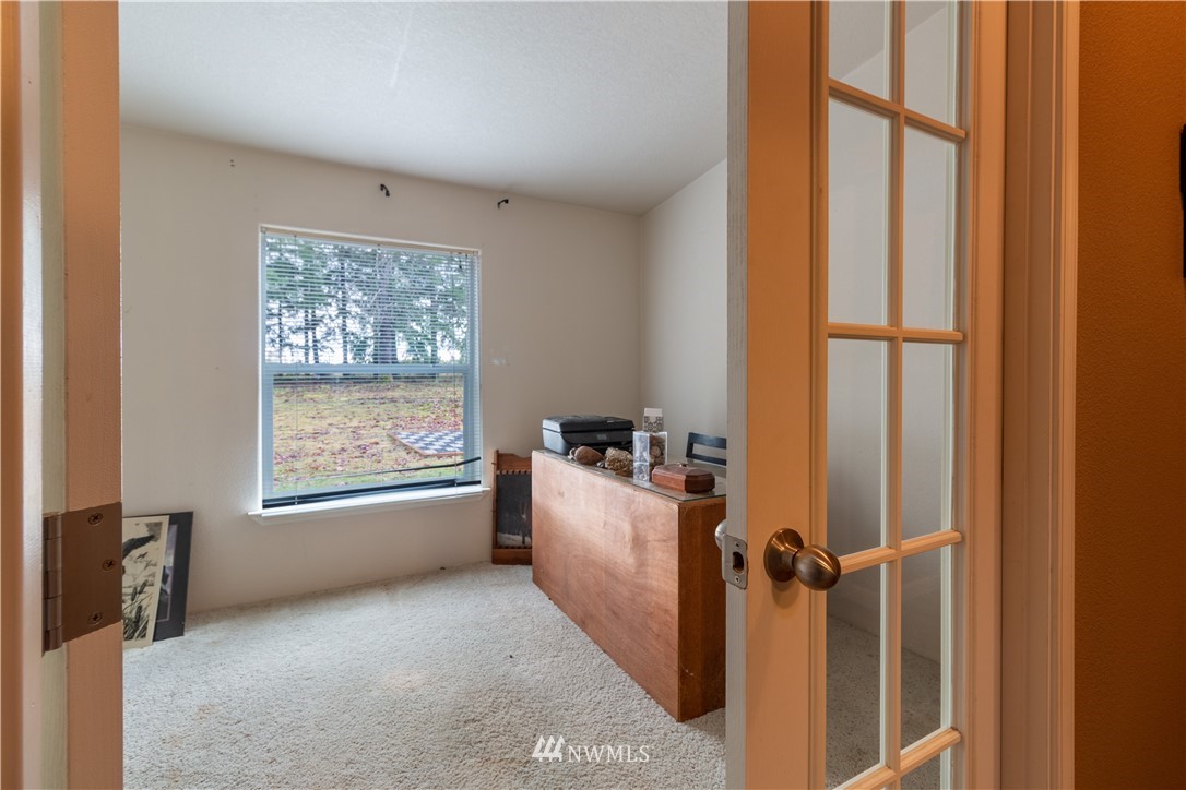 176 Nelson Road Winlock, WA 98596 - Photo 8 of 16 a view of an empty room with a window