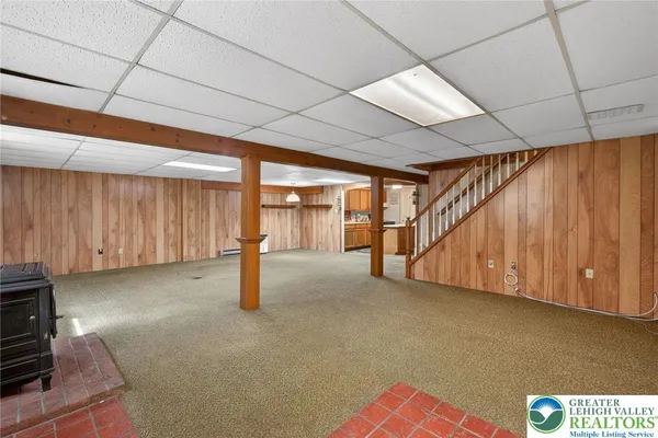 a view of a room with wooden walls