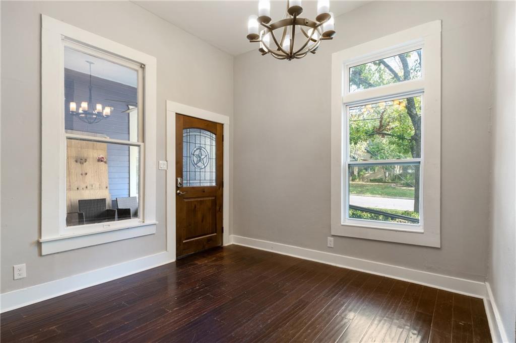 3210 Hampton Road, Unit A B C Austin, TX 78705 - Photo 38 of 42 Entryway featuring dark wood-finish flooring, a decorative wood door with leaded glass, and white trim