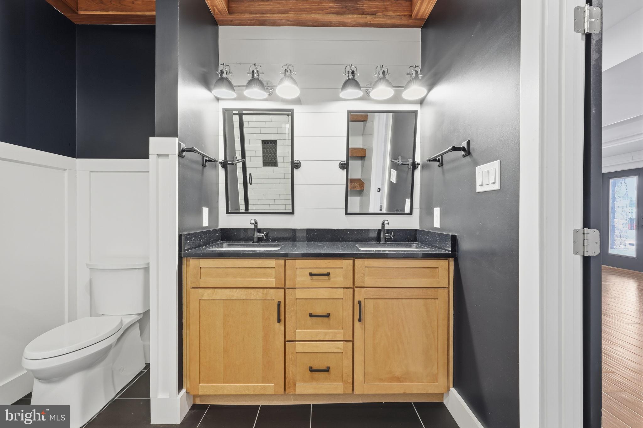 176 Fenstermaker Road Kutztown, PA 19530 - Photo 94 of 149 Sleek dual vanity in modern bathroom design.