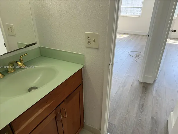 a bathroom with a white toilet and a shower