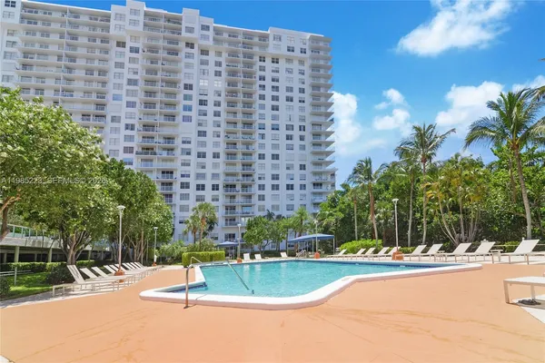 a view of a swimming pool and a yard