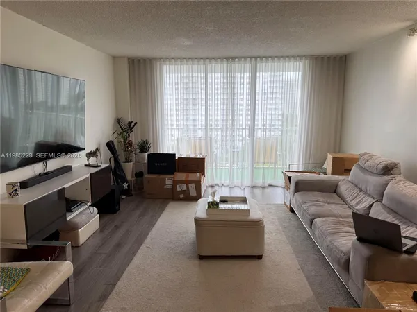a kitchen with granite countertop cabinets and window