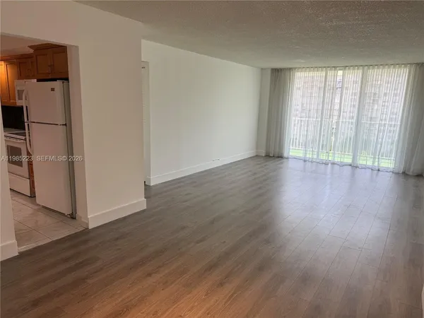 a kitchen with a stove and a refrigerator