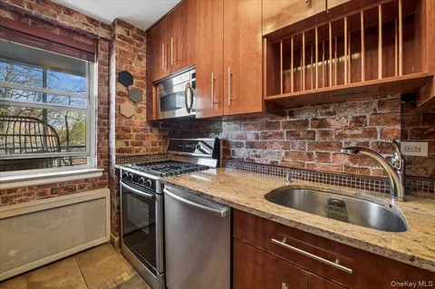 a kitchen that has a sink and a stove