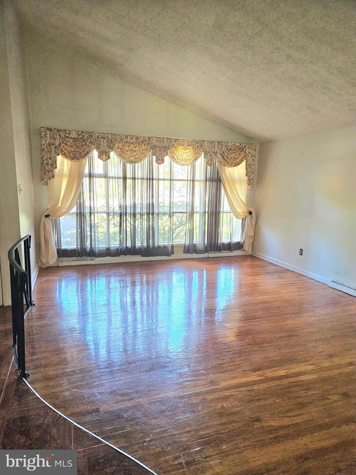 148 Church Road Elkins Park, PA 19027 - Photo 10 of 33 a view of empty room with wooden floor and fan
