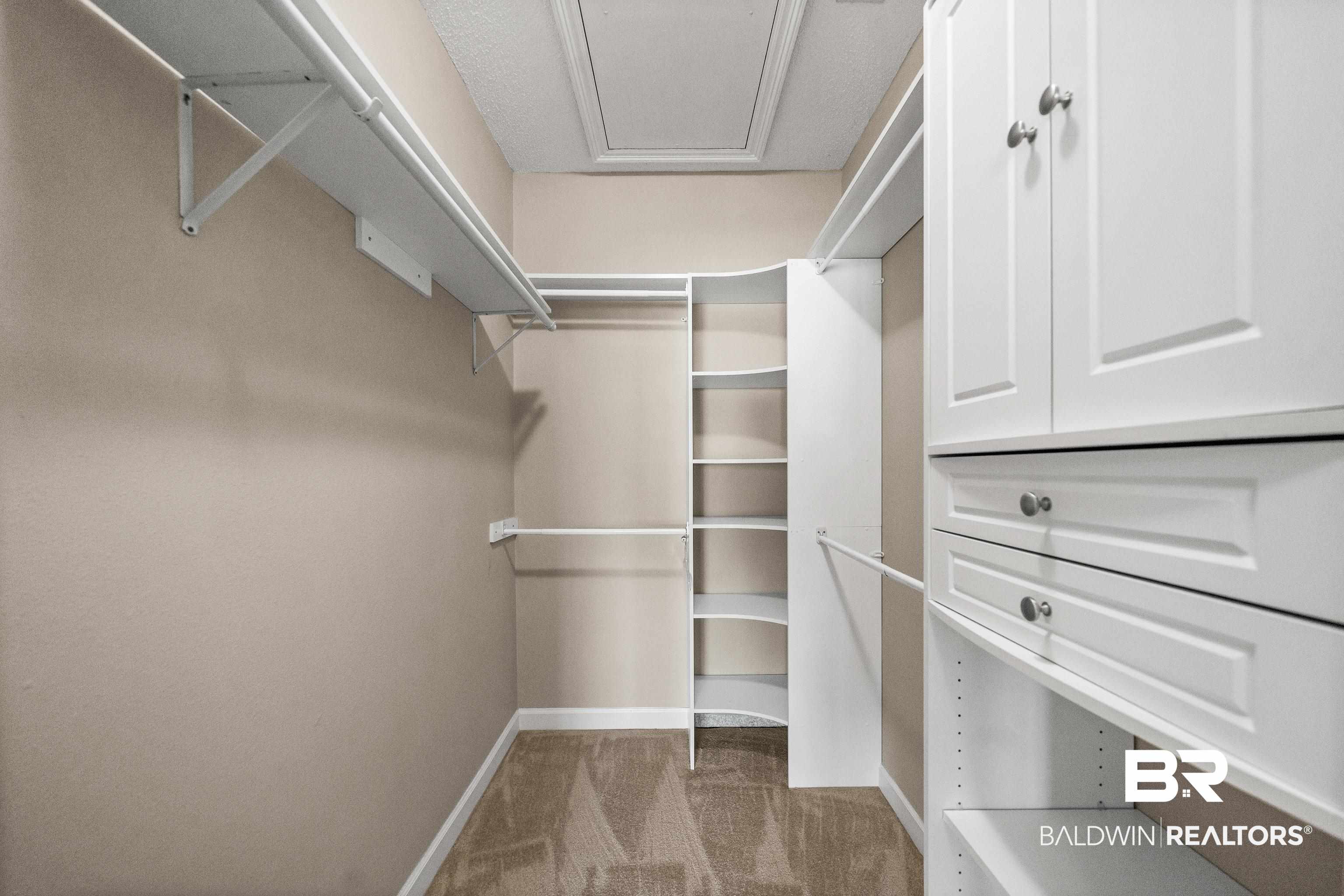 27 Cottage Drive Fairhope, AL 36532 - Photo 18 of 33 Spacious closet featuring light carpet