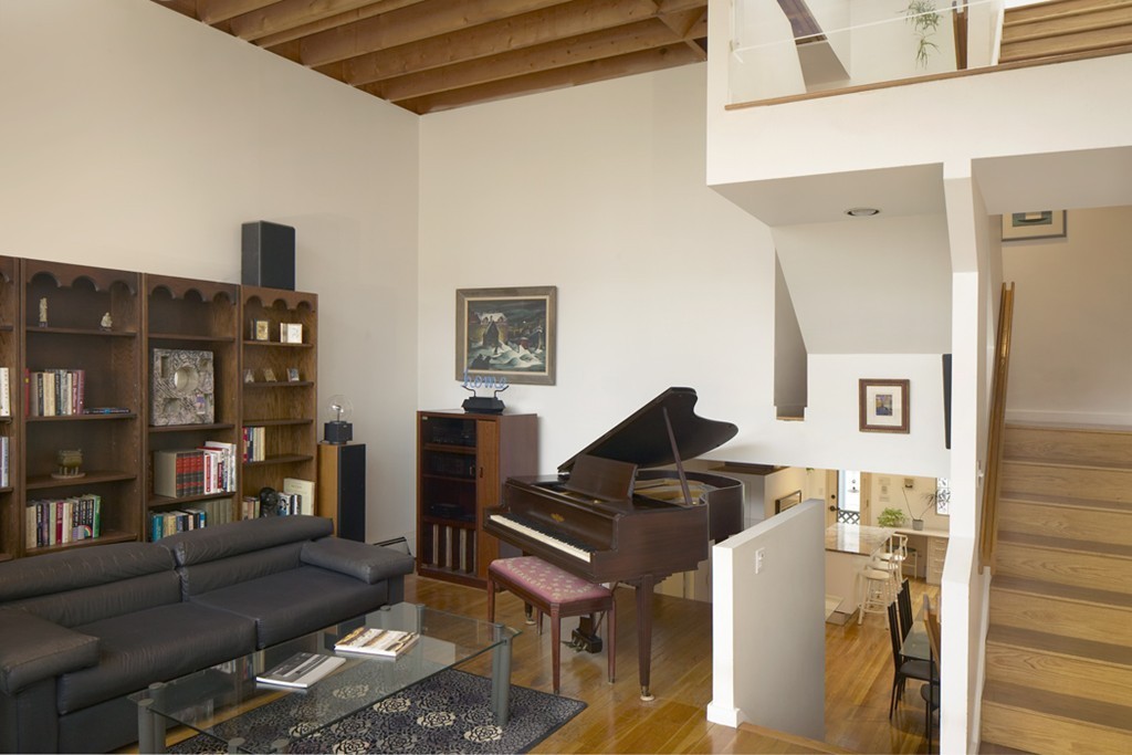 30 Inman Street, Unit C Cambridge, MA 02139 - Photo 2 of 8 a living room with furniture and wooden floor