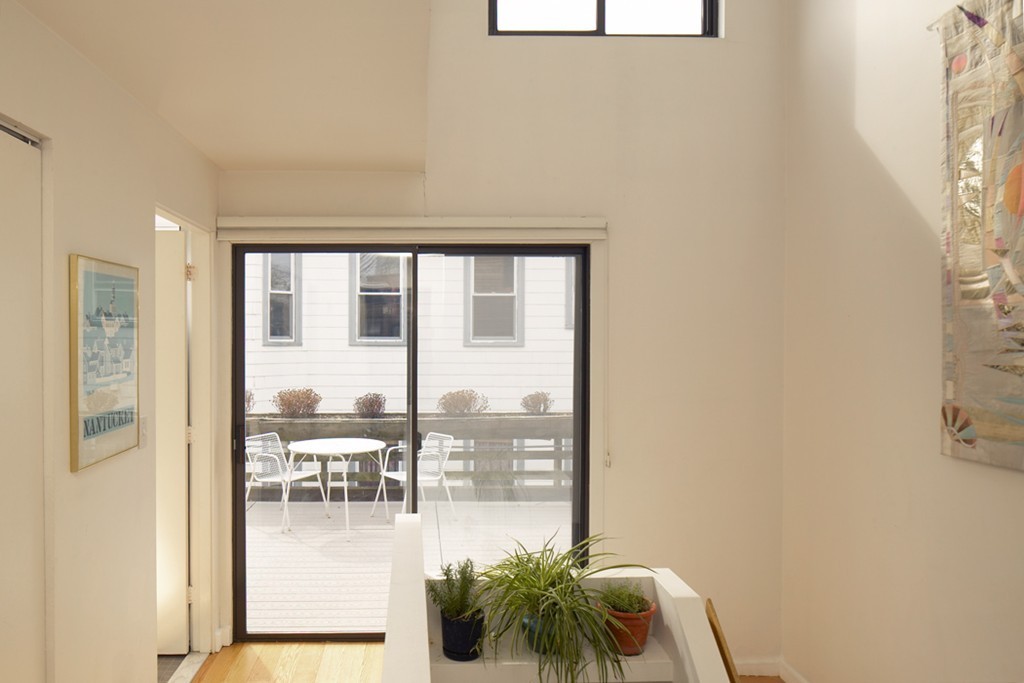 30 Inman Street, Unit C Cambridge, MA 02139 - Photo 5 of 8 a room with a large window and furniture