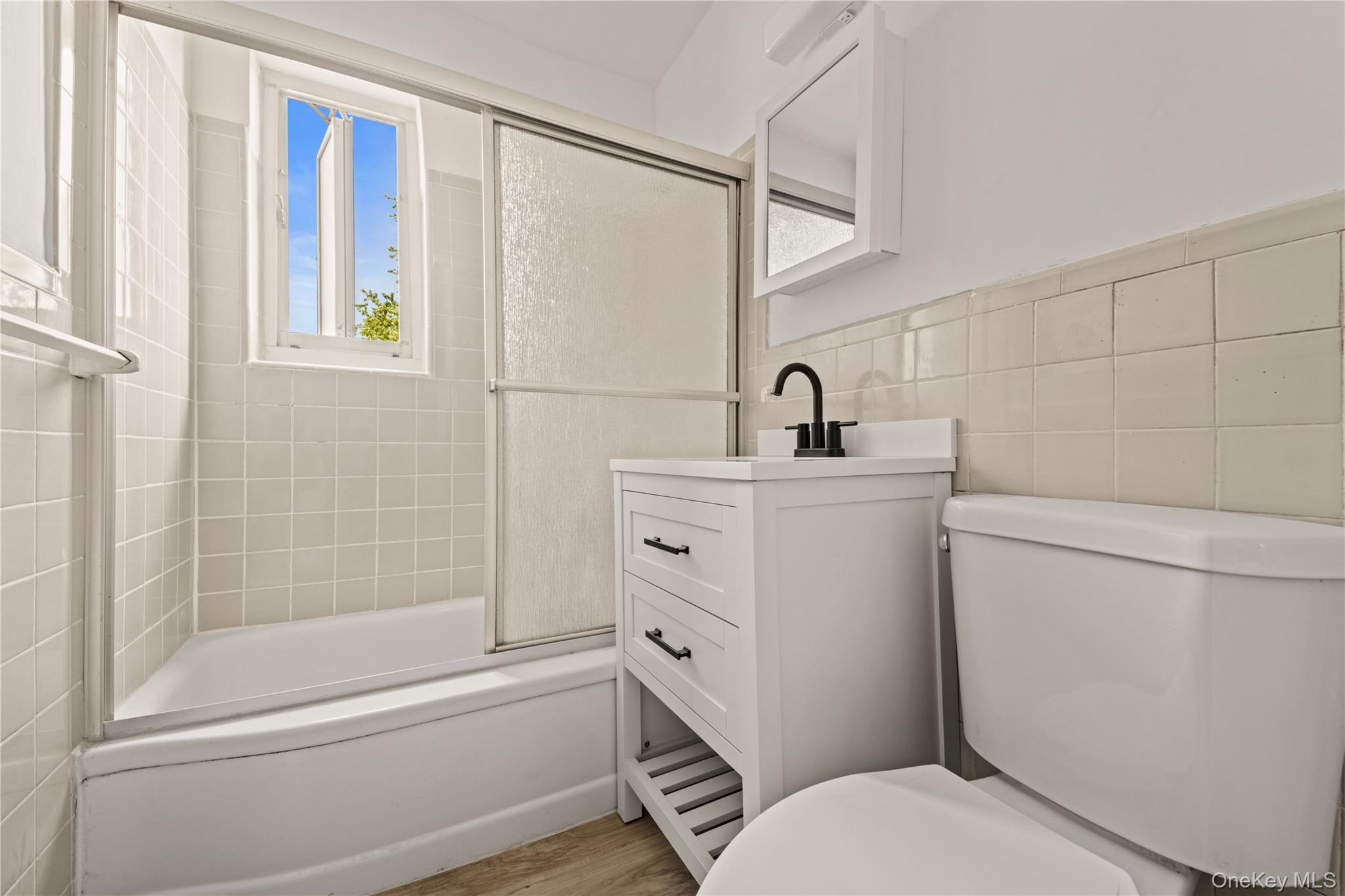 224-17 Manor Road, Unit LOWR Queens, NY 11427 - Photo 13 of 16 a bathroom with a sink toilet and shower