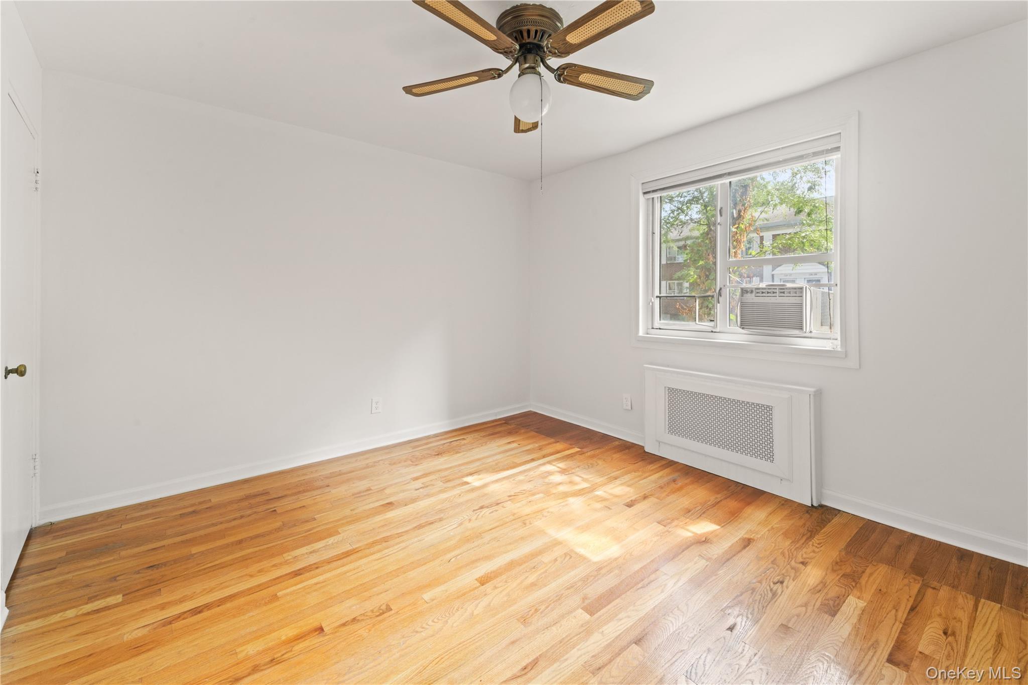 224-17 Manor Road, Unit LOWR Queens, NY 11427 - Photo 7 of 16 a view of an empty room with a window
