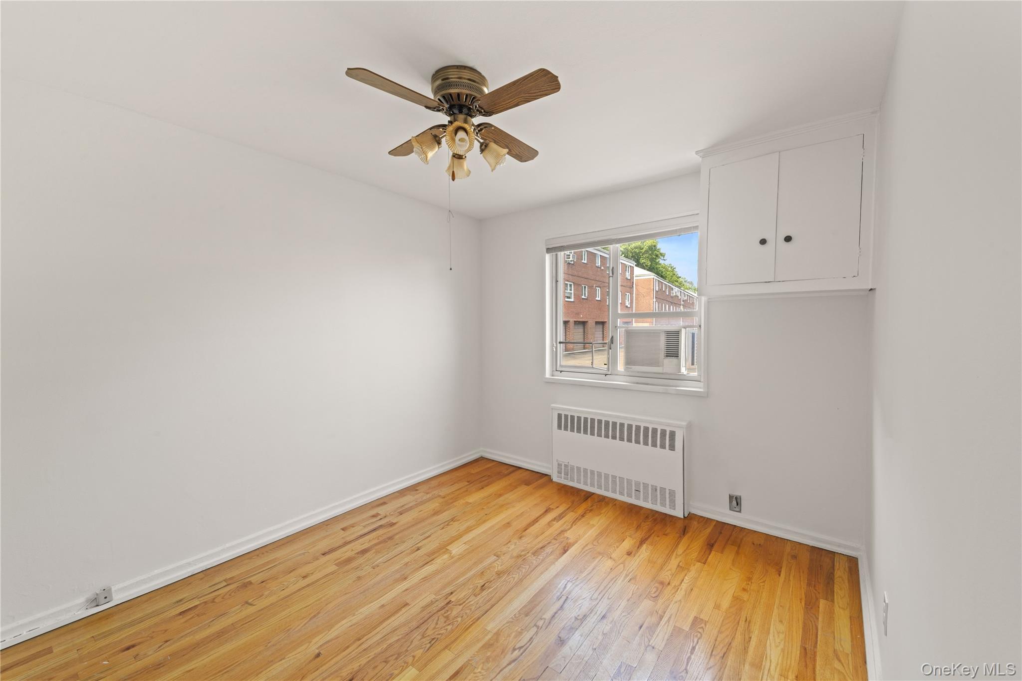 224-17 Manor Road, Unit LOWR Queens, NY 11427 - Photo 8 of 16 an empty room with windows