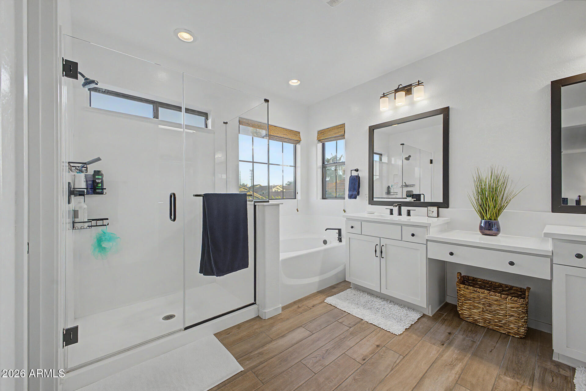 819 West Deer Creek Road Phoenix, AZ 85048 - Photo 38 of 76 a spacious bathroom with a double vanity sink a mirror and a shower