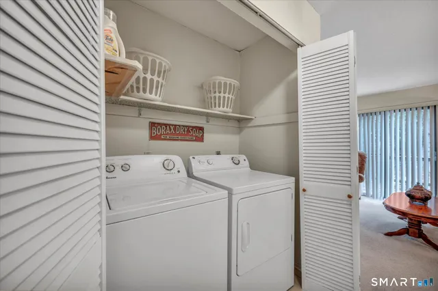 a utility room with dryer and washer