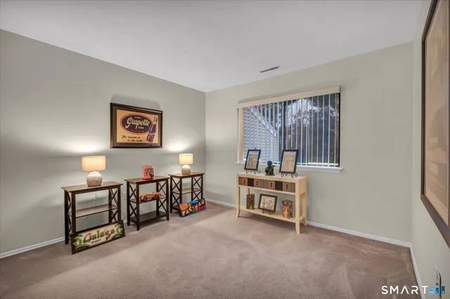 a bed room with furniture and a window