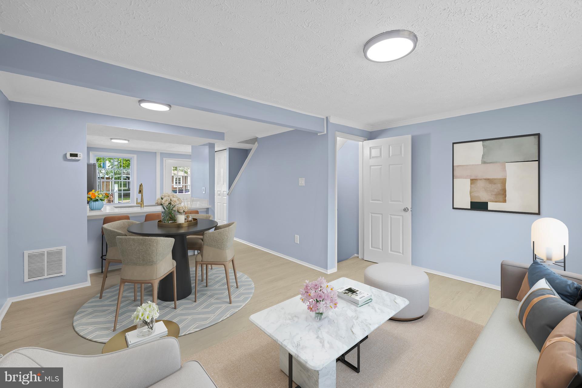 8318 Brookvale Court Springfield, VA 22153 - Photo 11 of 39 a view of a dining room with furniture and wooden floor