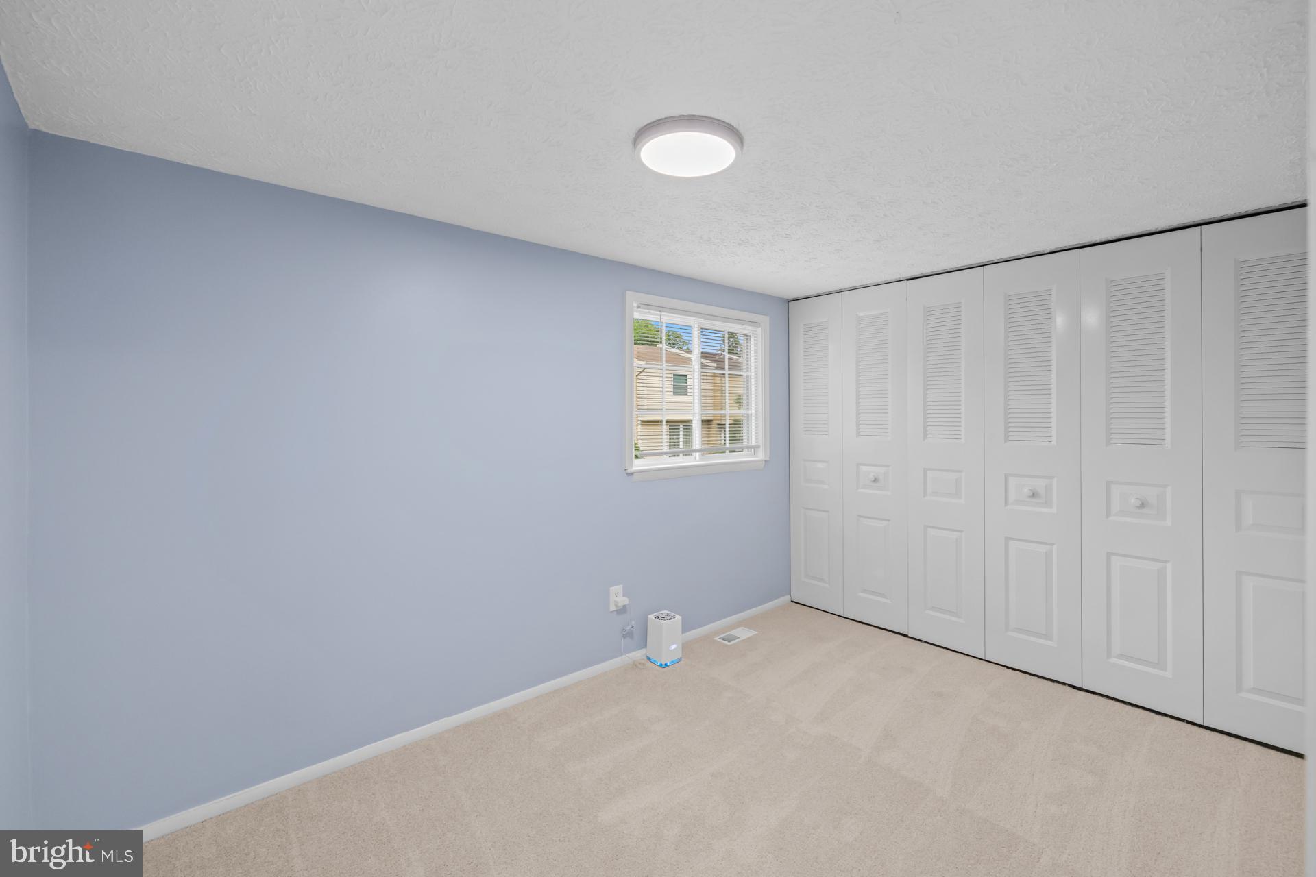 8318 Brookvale Court Springfield, VA 22153 - Photo 16 of 39 a view of an empty room with a window