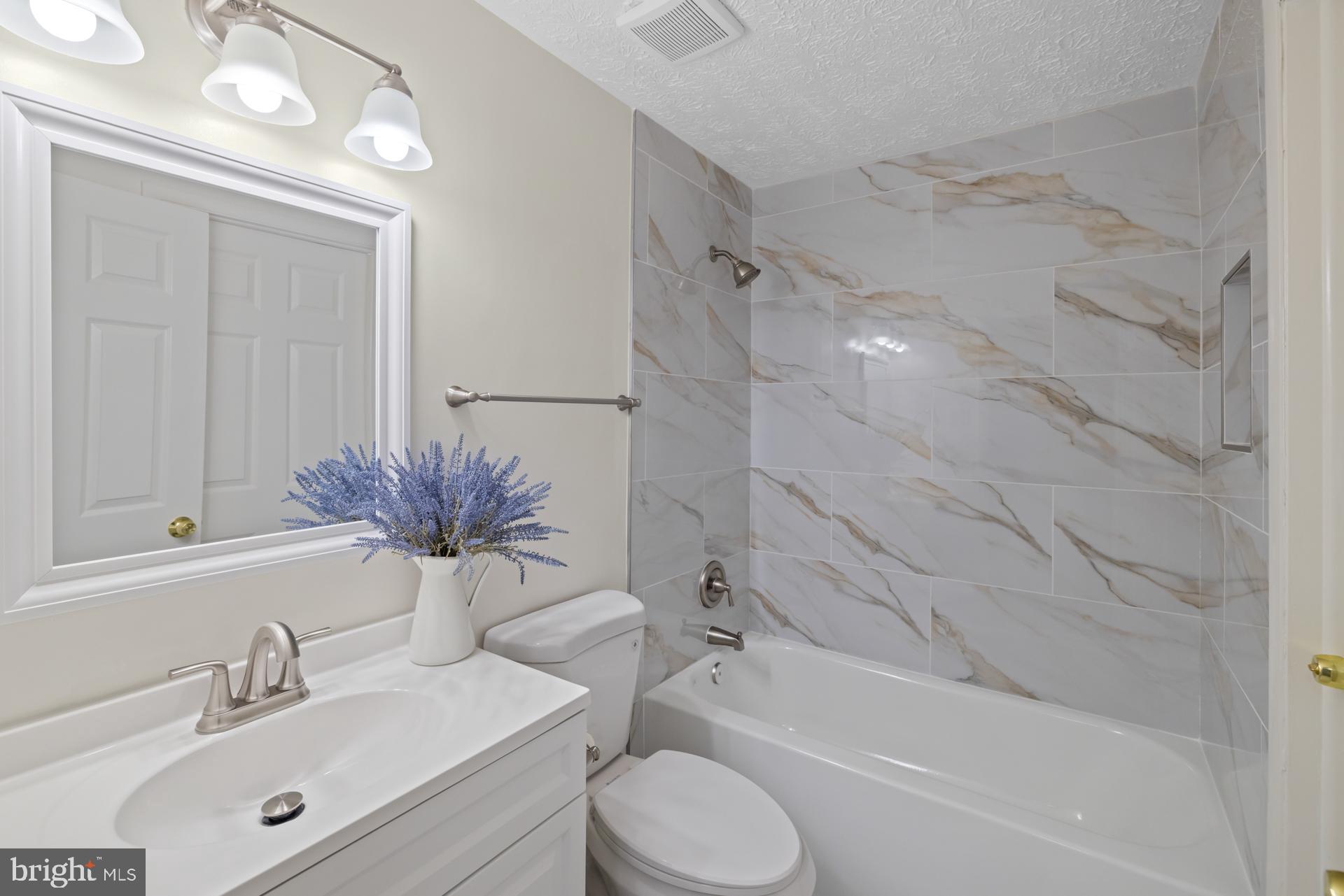 8318 Brookvale Court Springfield, VA 22153 - Photo 20 of 39 a bathroom with a sink toilet and shower