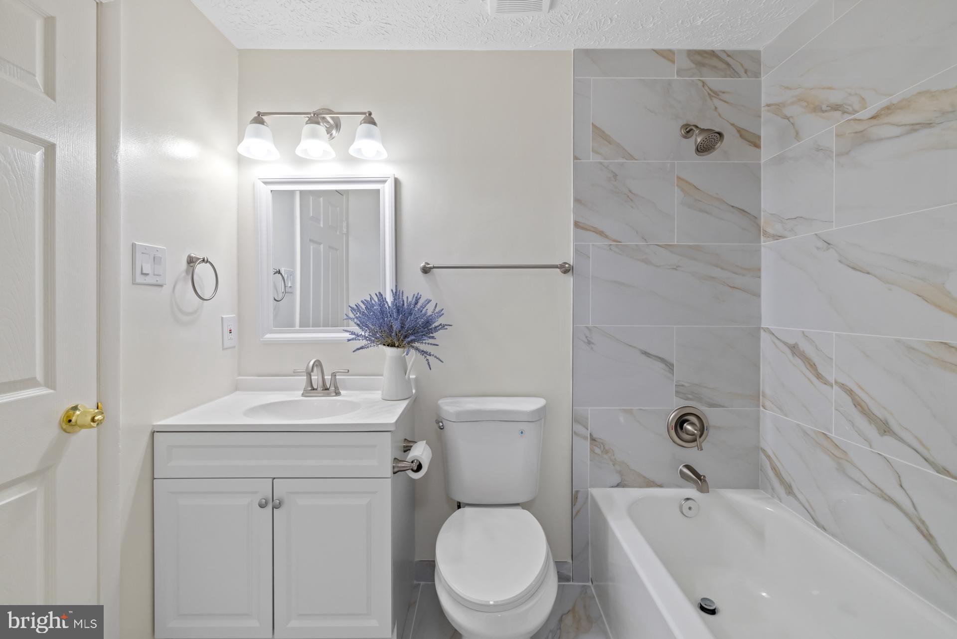 8318 Brookvale Court Springfield, VA 22153 - Photo 21 of 39 a bathroom with a sink toilet and shower