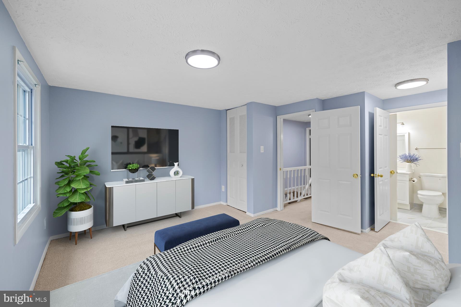 8318 Brookvale Court Springfield, VA 22153 - Photo 25 of 39 a bedroom with furniture and a flat screen tv