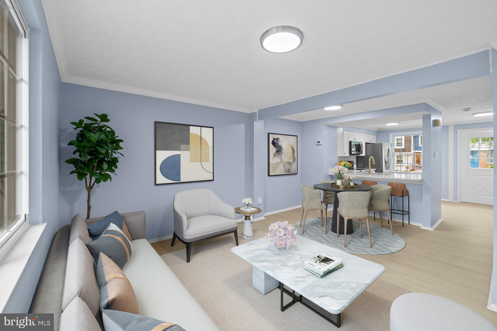 8318 Brookvale Court Springfield, VA 22153 - Photo 3 of 39 a living room with furniture a potted plant and a window