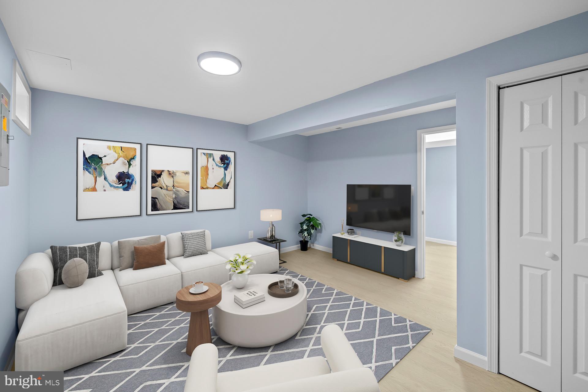 8318 Brookvale Court Springfield, VA 22153 - Photo 34 of 39 a living room with furniture and a flat screen tv