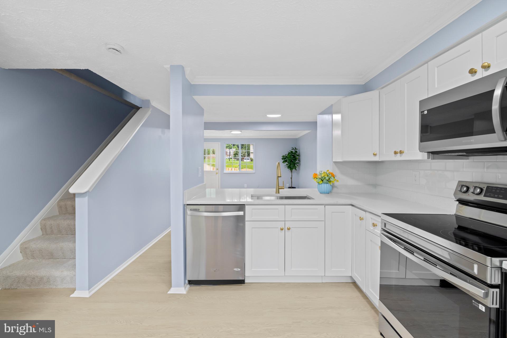 8318 Brookvale Court Springfield, VA 22153 - Photo 5 of 39 a kitchen with a sink and cabinets