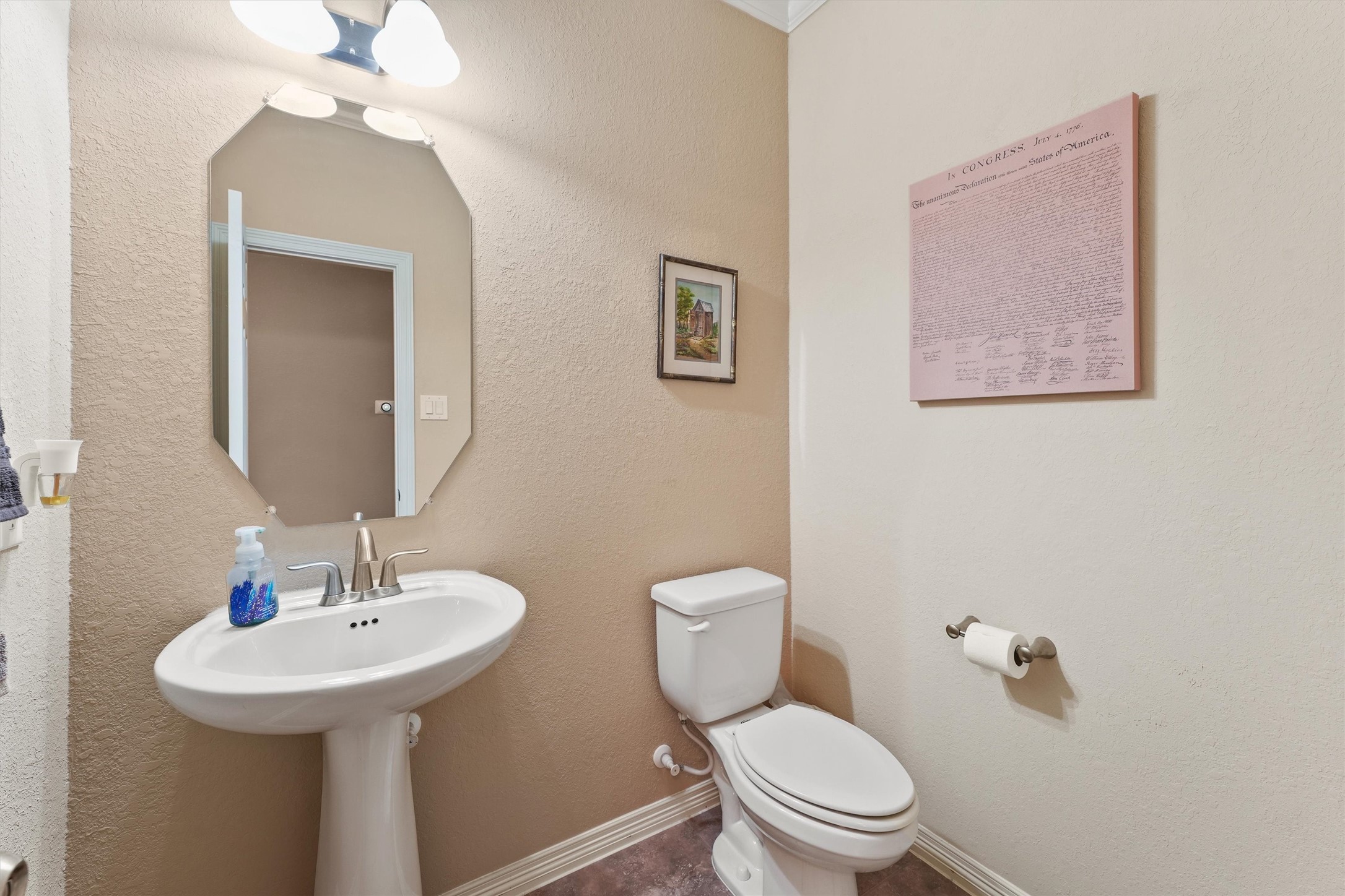 529 Water Street Webster, TX 77598 - Photo 15 of 38 a bathroom with a toilet sink and mirror