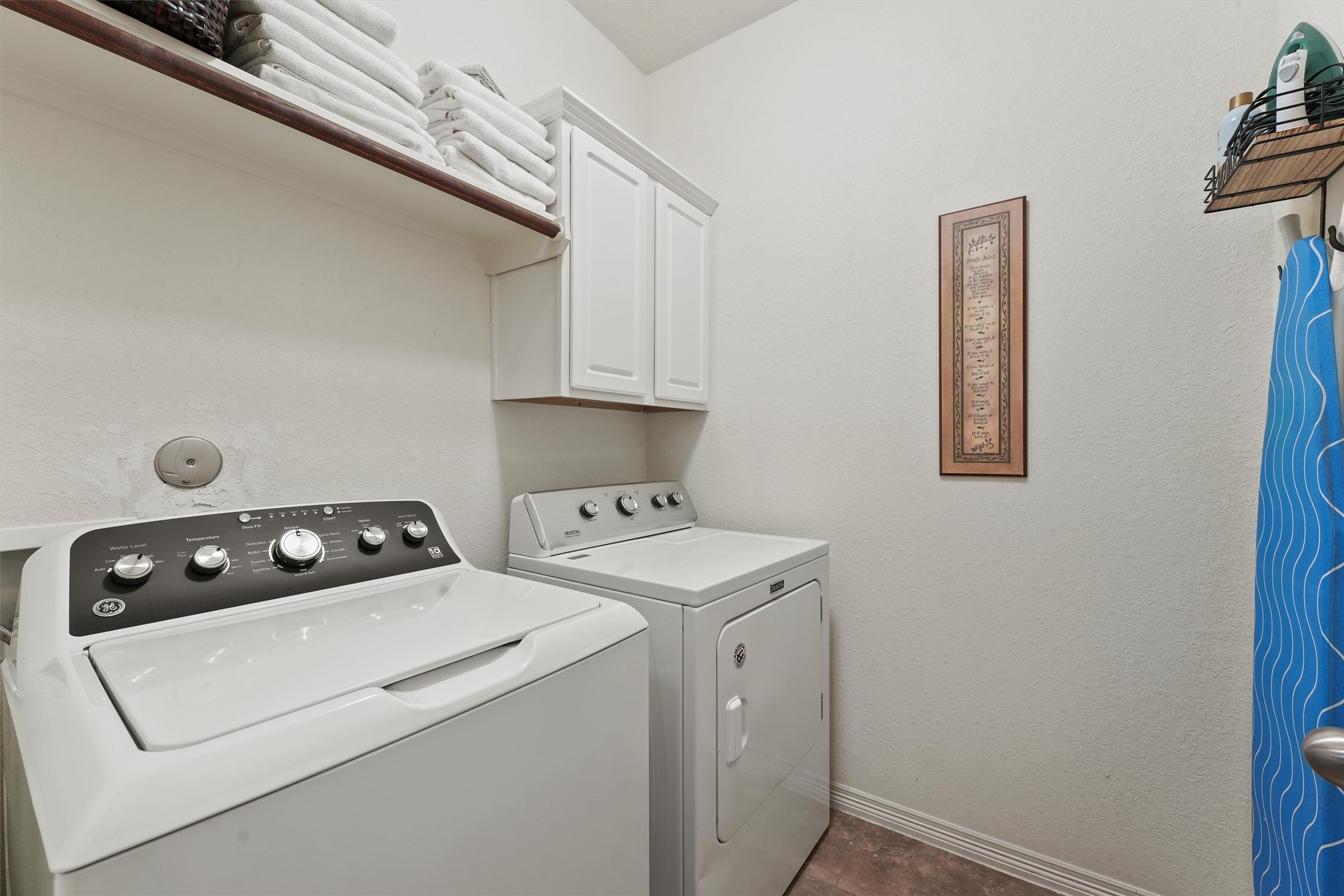 529 Water Street Webster, TX 77598 - Photo 18 of 38 The home has a spacious laundry room off to the side of the primary bedroom.