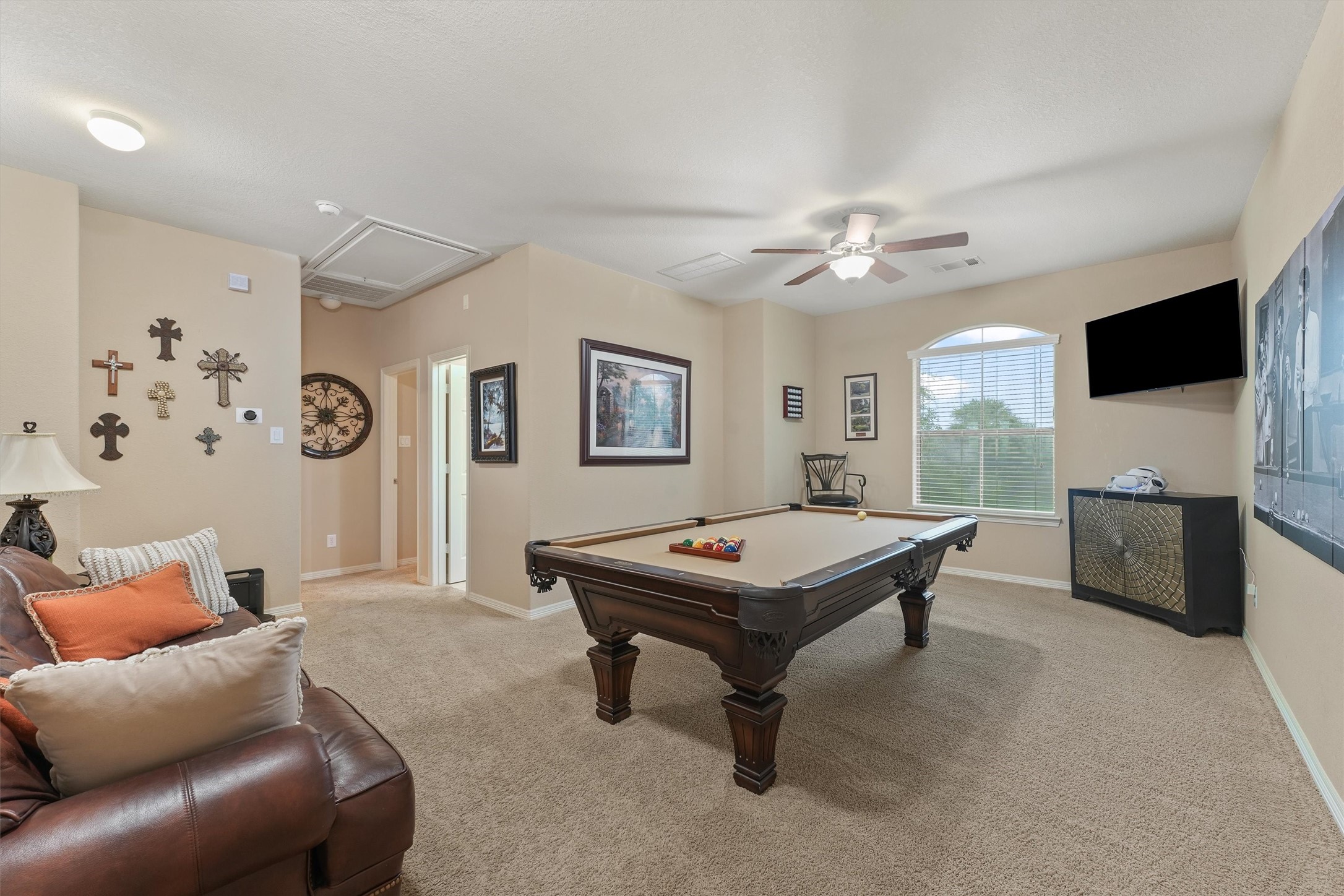 529 Water Street Webster, TX 77598 - Photo 20 of 38 a living room with furniture and a flat screen tv