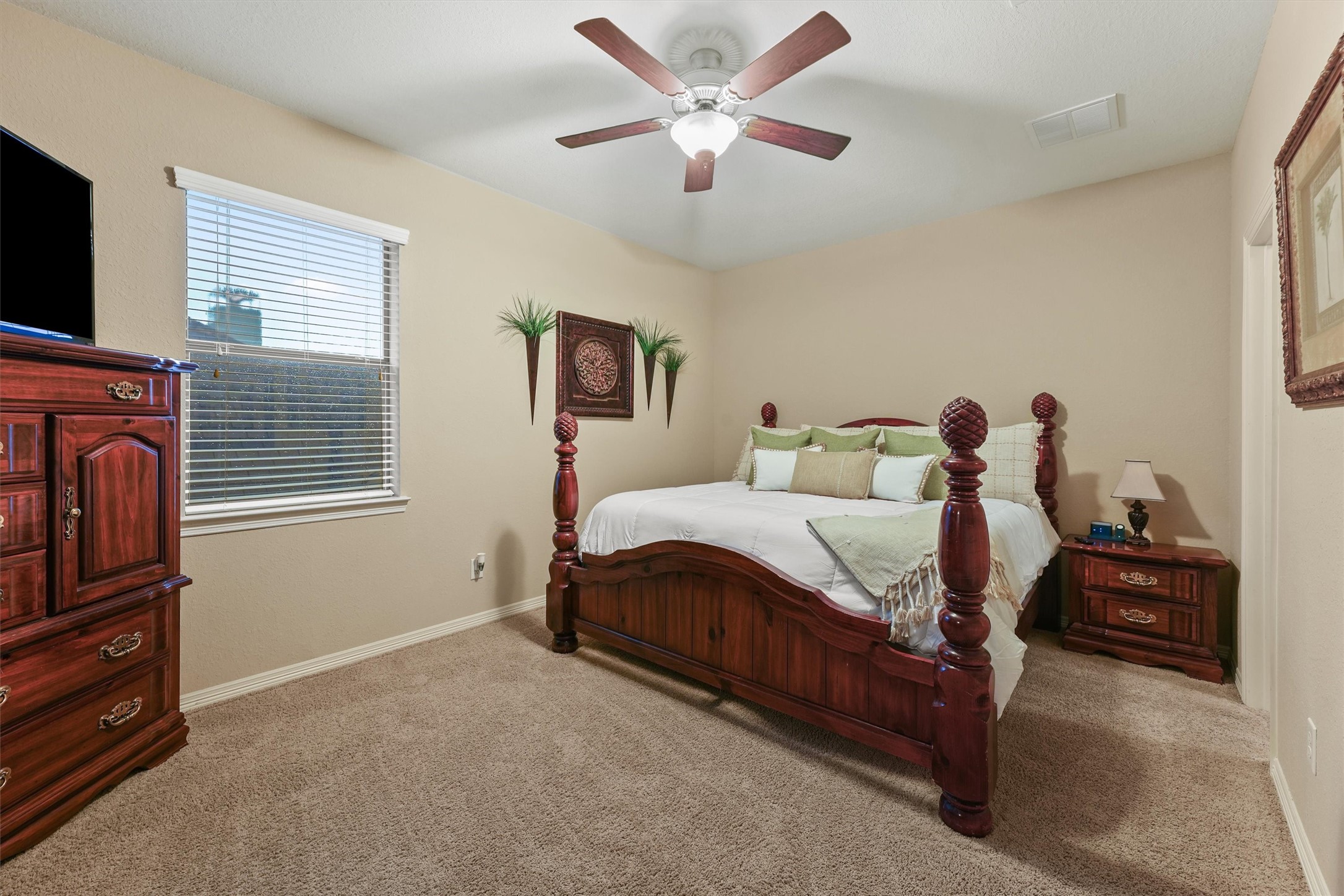529 Water Street Webster, TX 77598 - Photo 21 of 38 a bedroom with a bed and a tv