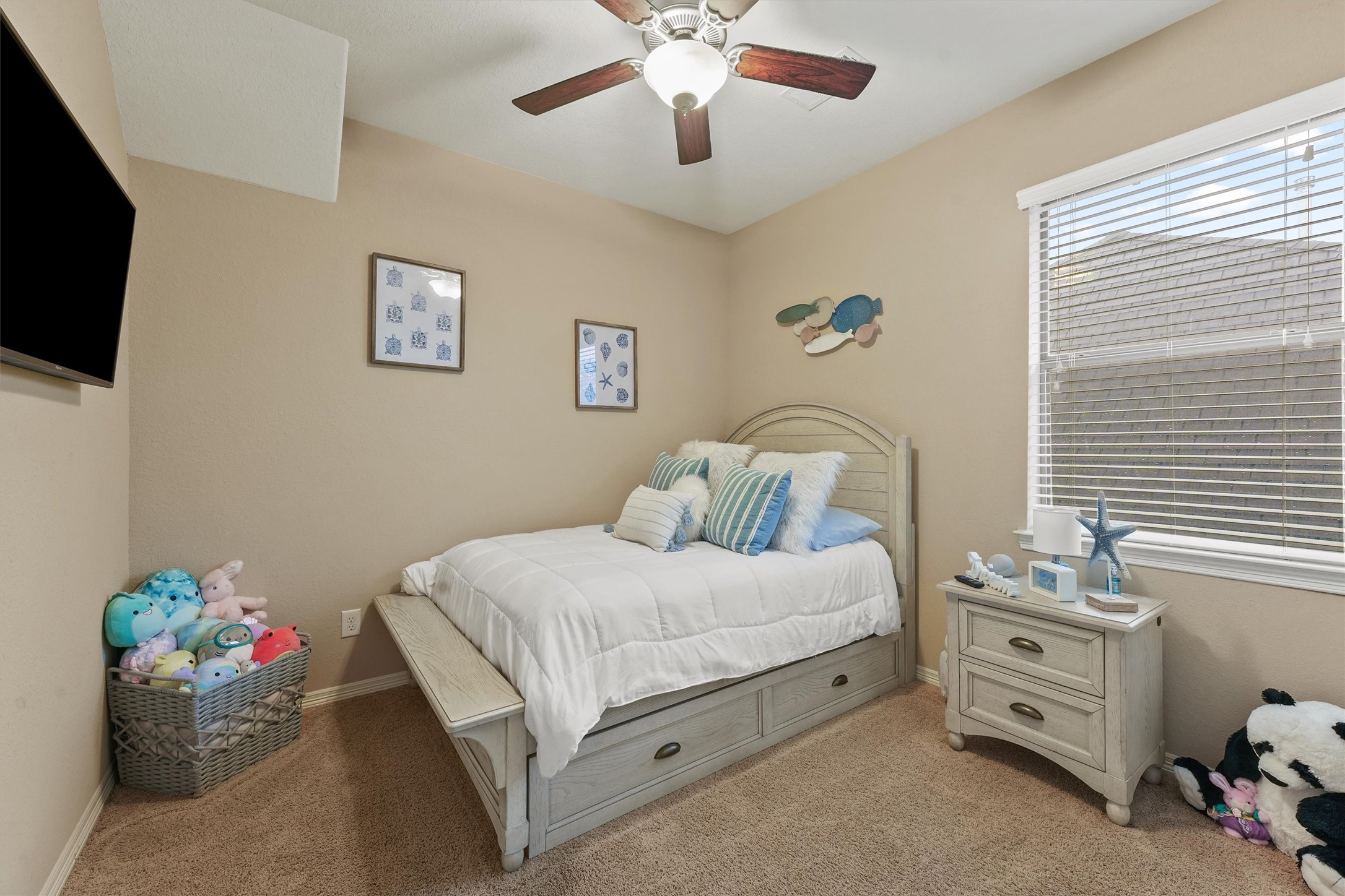 529 Water Street Webster, TX 77598 - Photo 24 of 38 a bedroom with a bed and a flat screen tv