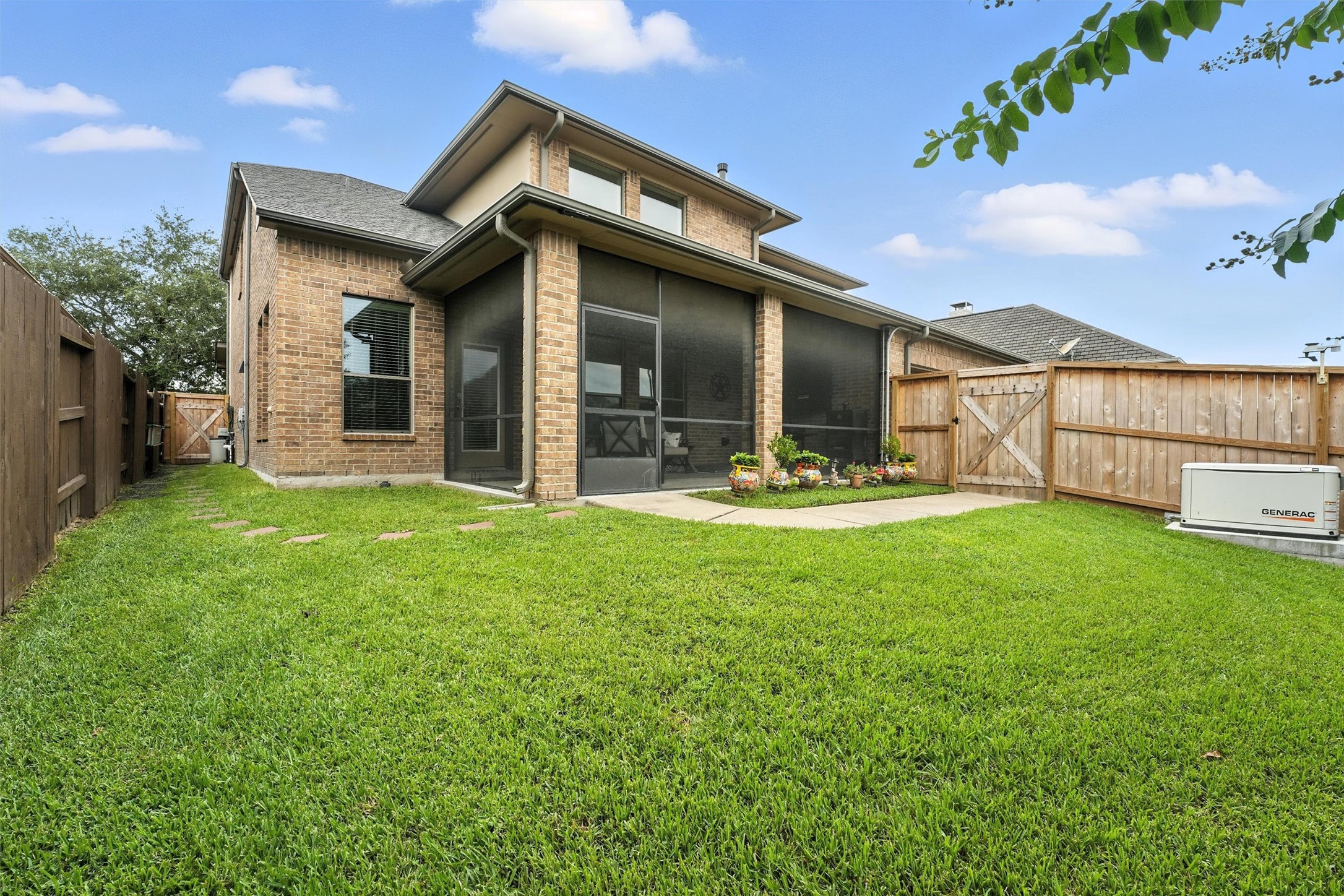529 Water Street Webster, TX 77598 - Photo 26 of 38 A spacious backyard with a view of the home Generac.