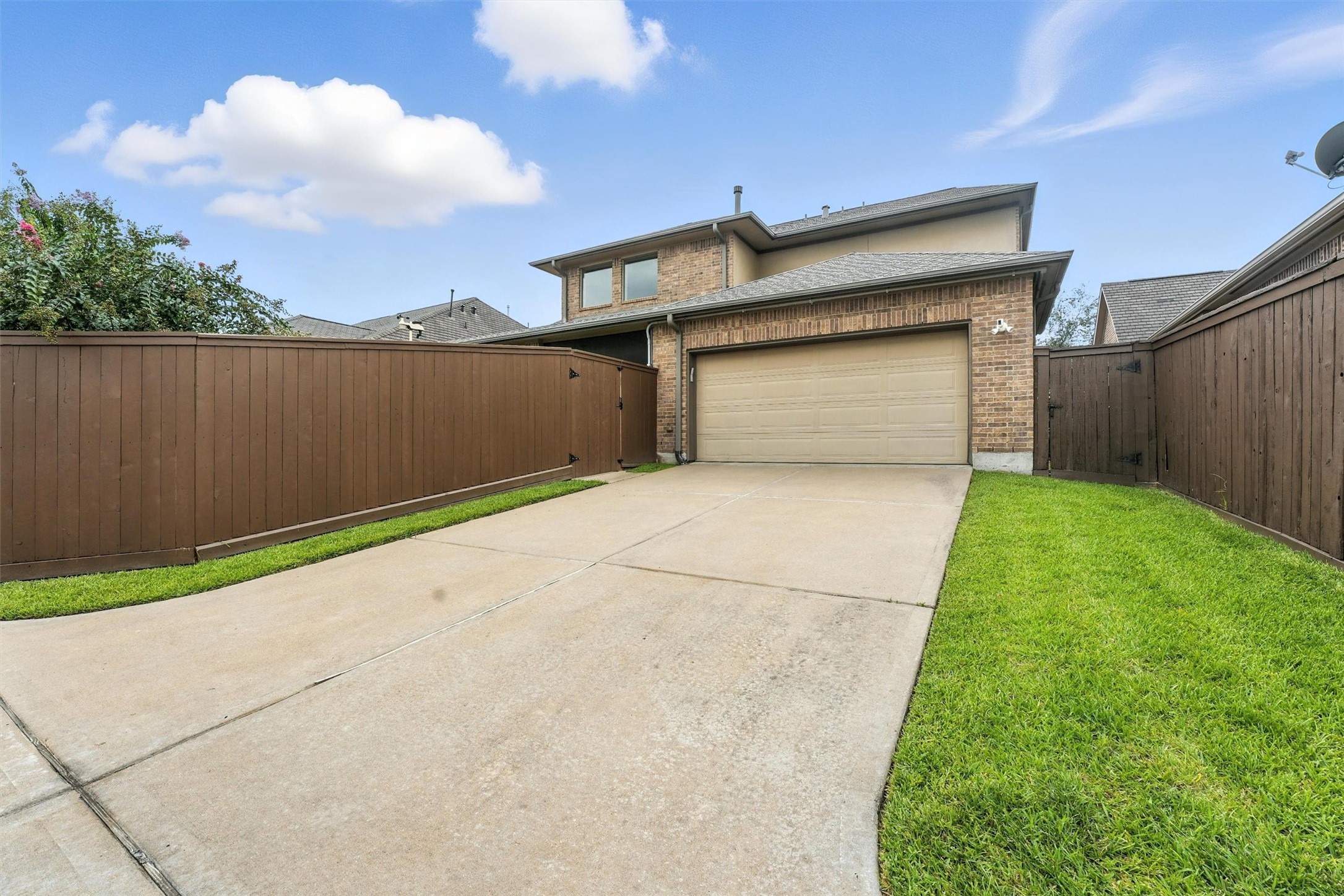 529 Water Street Webster, TX 77598 - Photo 28 of 38 a front view of a house with a yard and garage