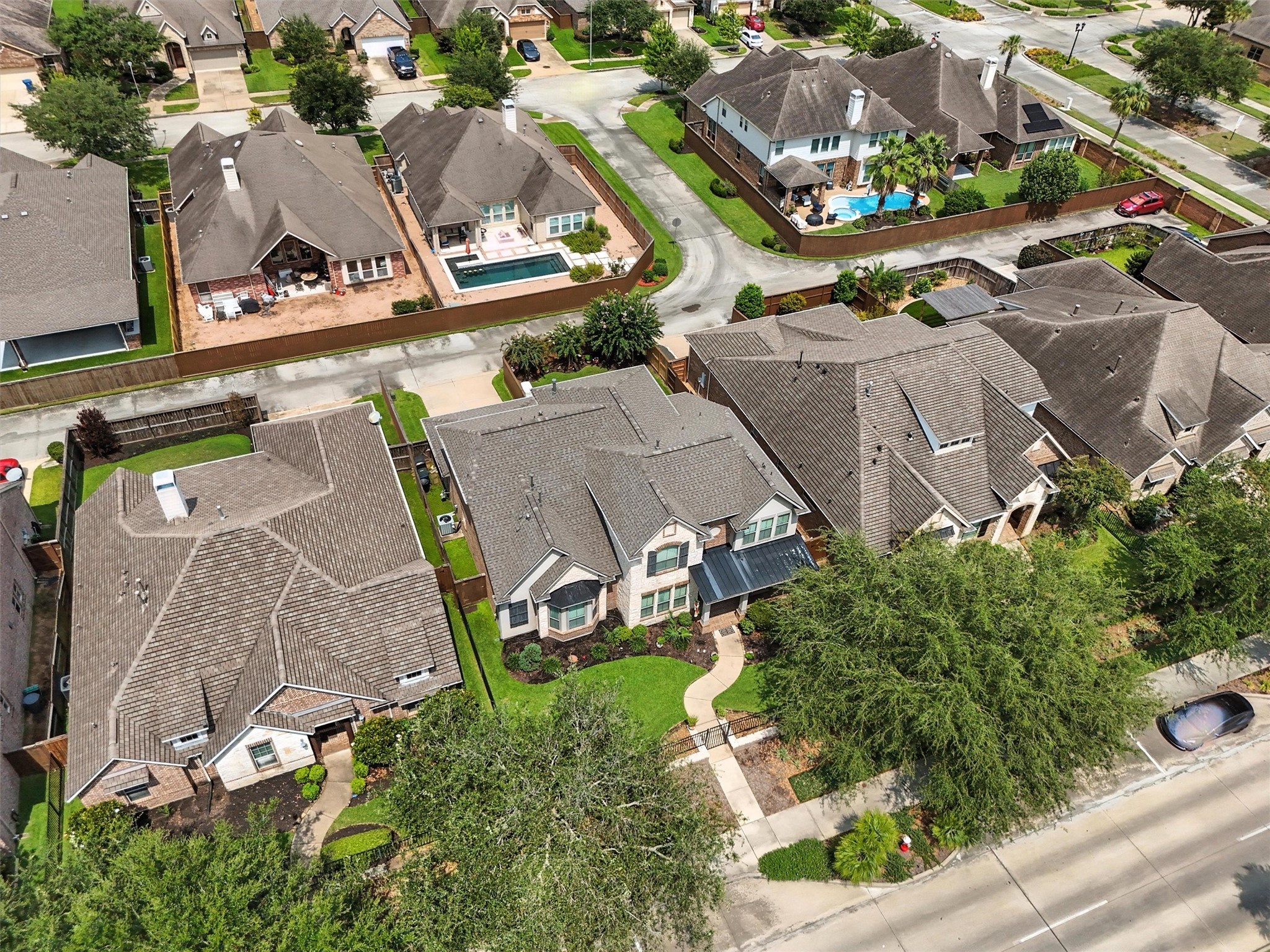 529 Water Street Webster, TX 77598 - Photo 30 of 38 Mature trees around the home offer shade and privacy.