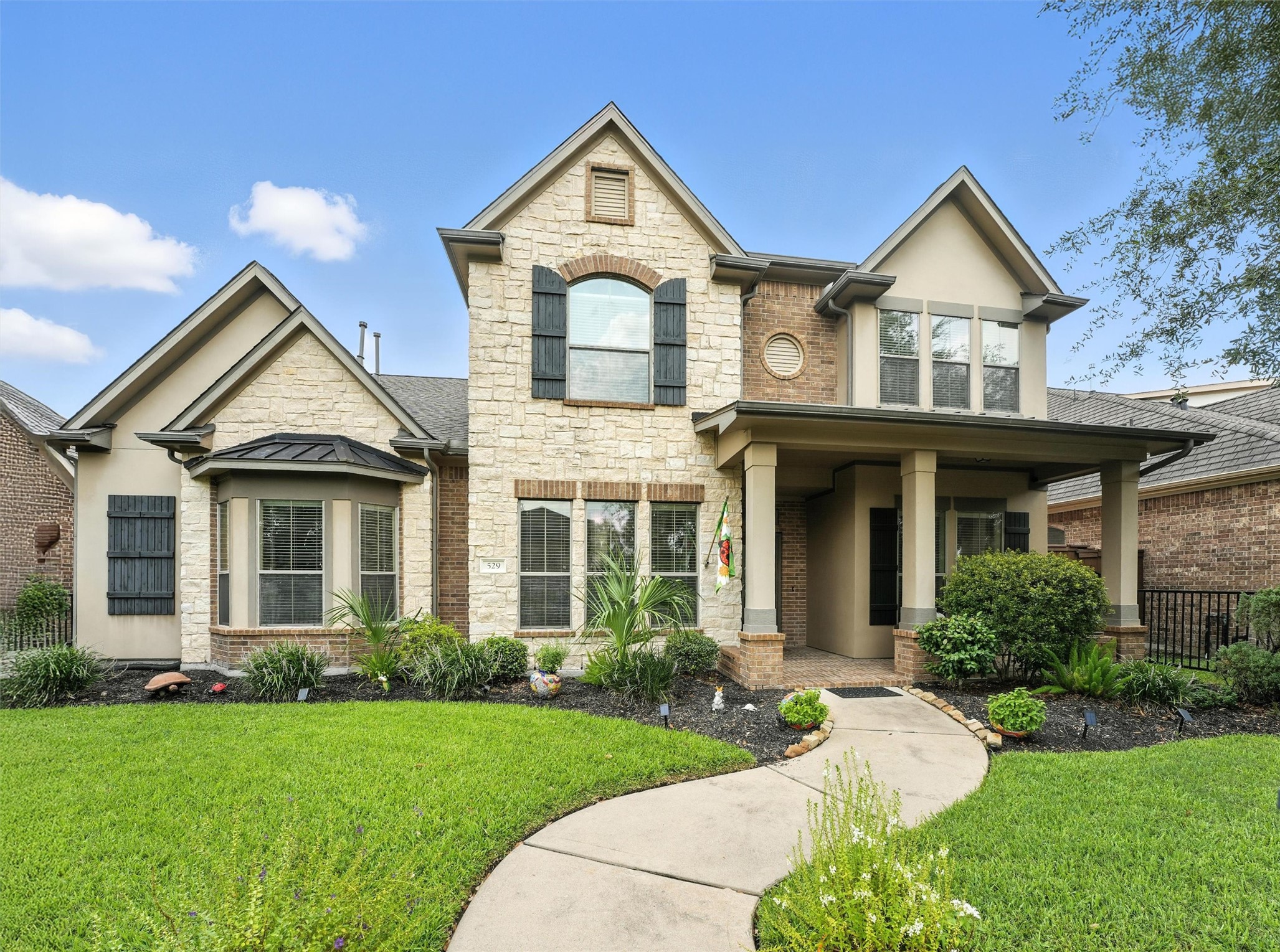 529 Water Street Webster, TX 77598 - Photo 3 of 38 Welcome to 592 Water St. The exterior provides a beautiful combination of stone and brick.