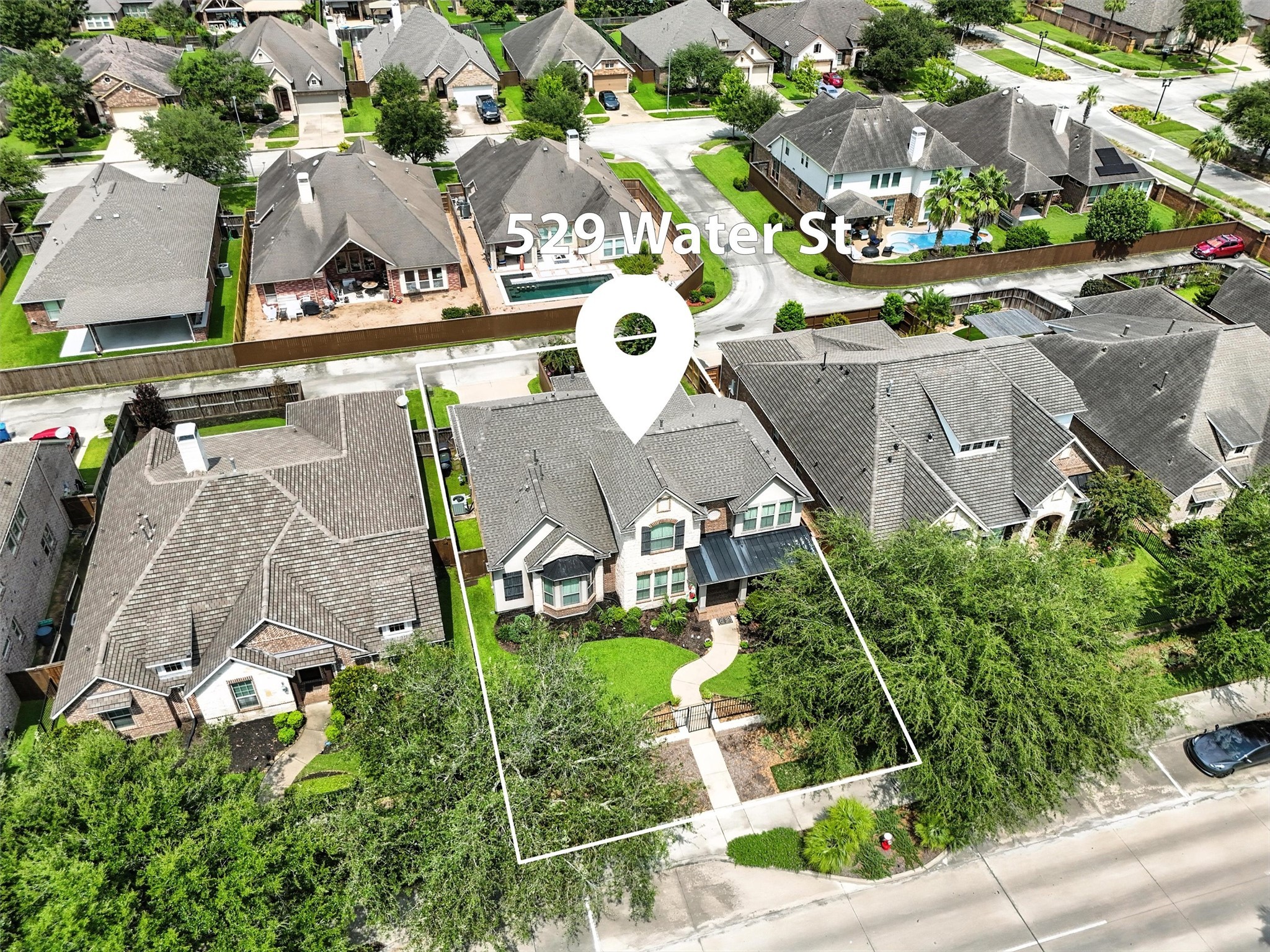 529 Water Street Webster, TX 77598 - Photo 31 of 38 an aerial view of residential houses with outdoor space