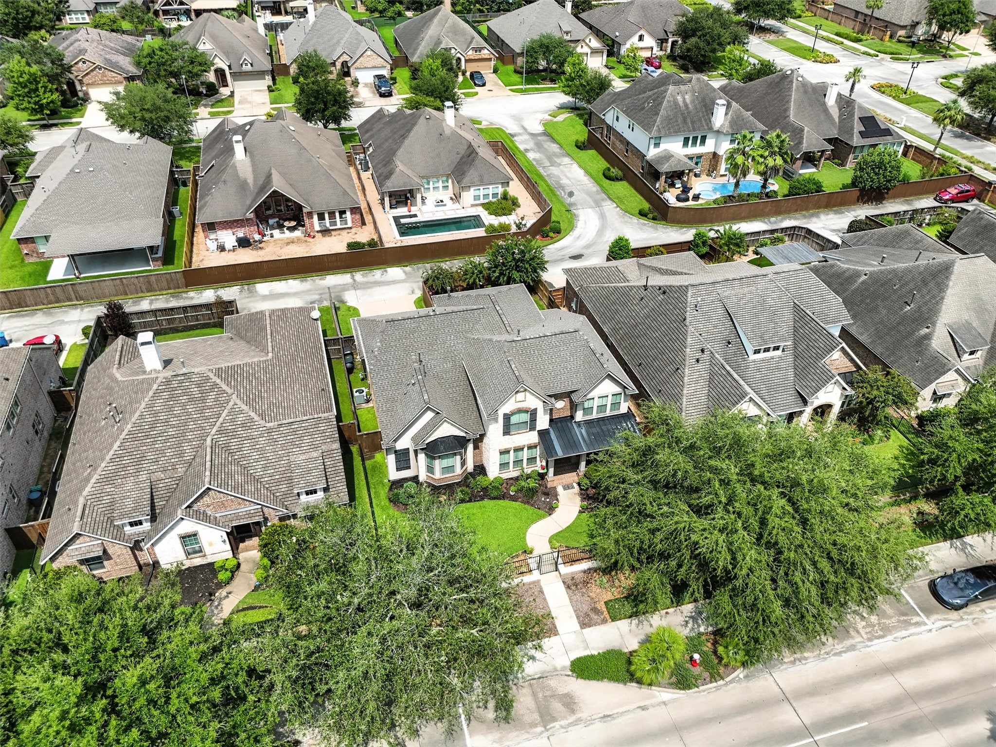 529 Water Street Webster, TX 77598 - Photo 34 of 38 an aerial view of a house with garden space and street view
