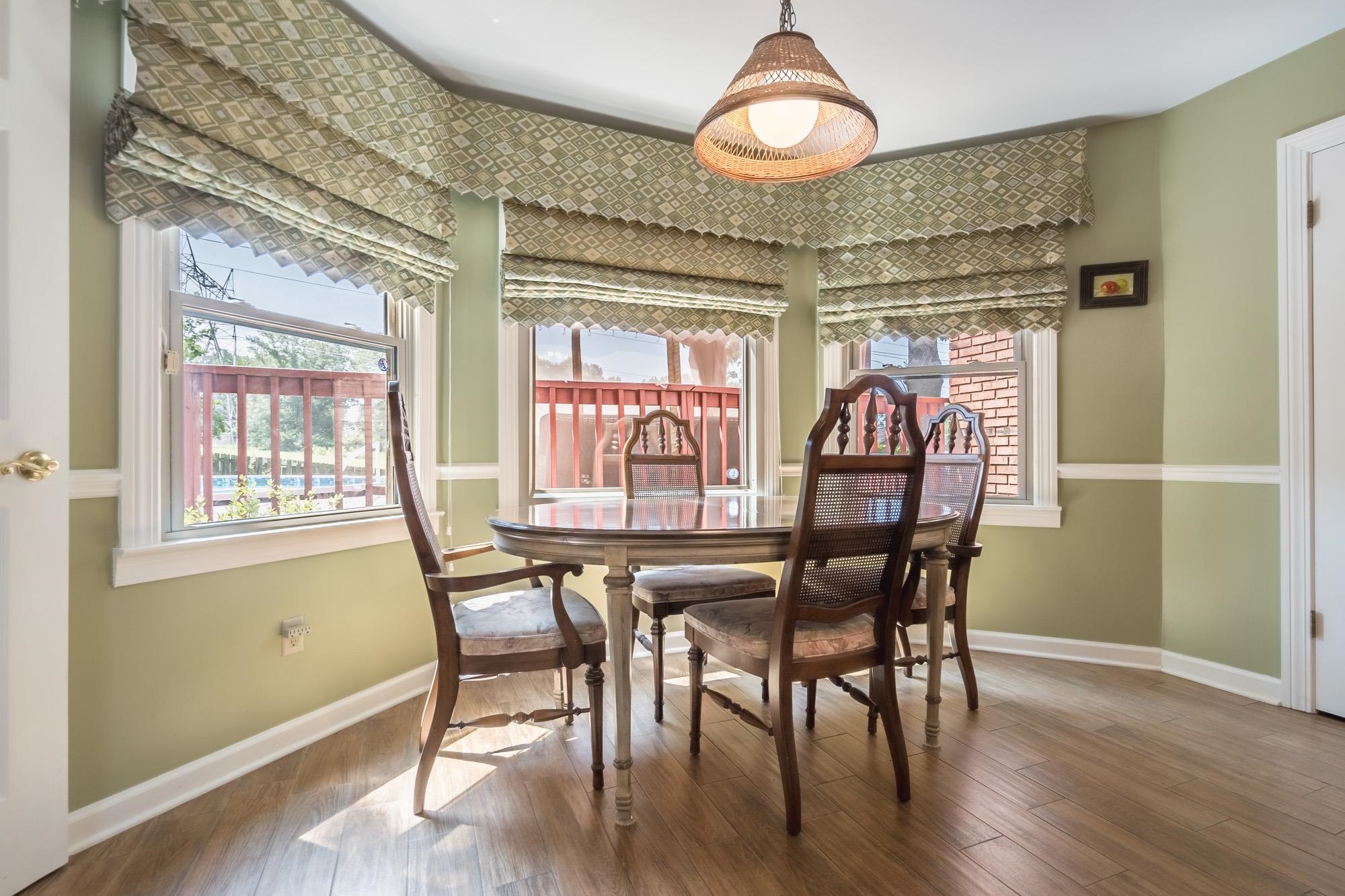 132 South Walnut Bend Road Memphis, TN 38018 - Photo 11 of 23 a view of a dining room with furniture window and wooden floor