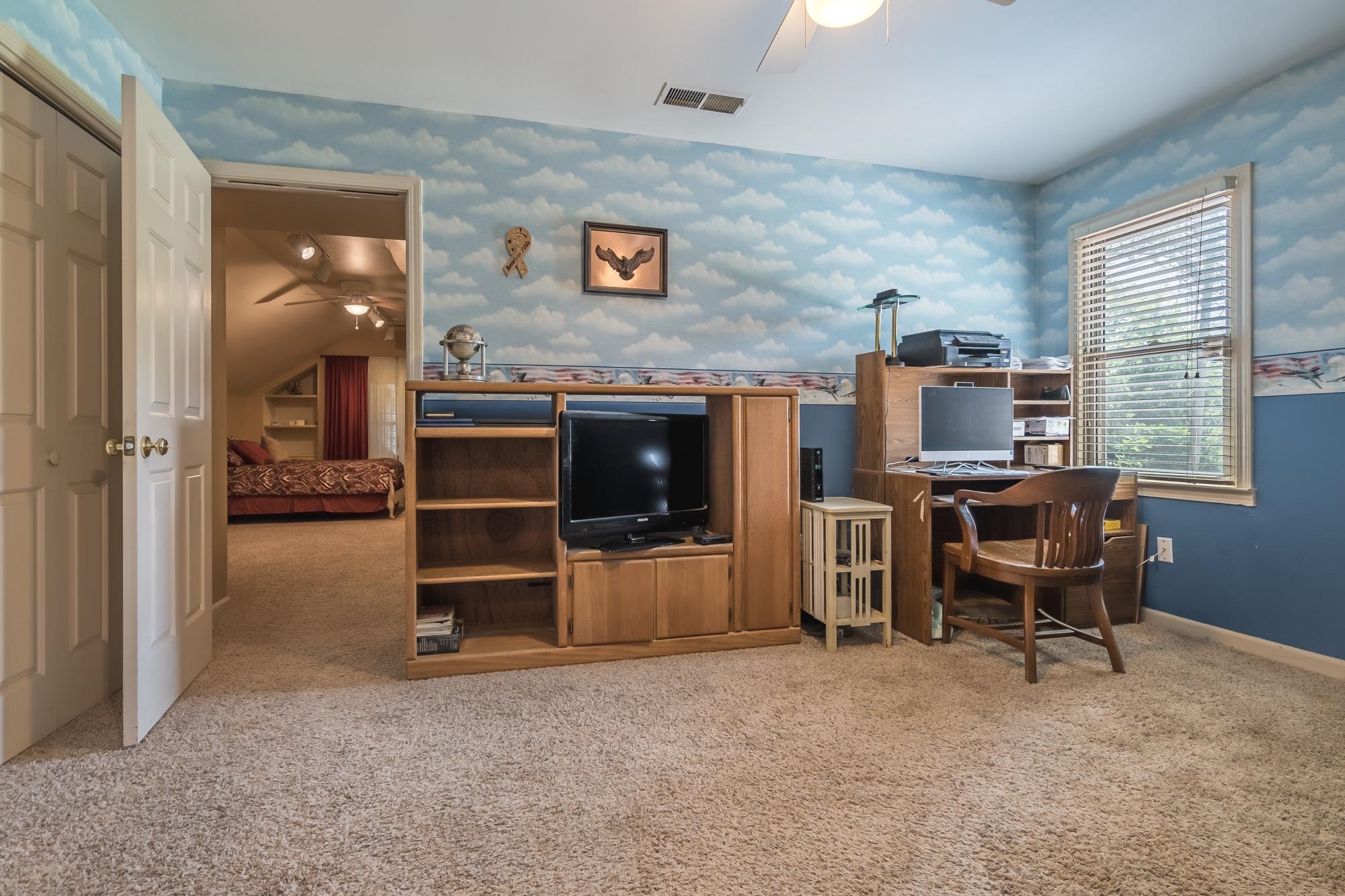 132 South Walnut Bend Road Memphis, TN 38018 - Photo 16 of 23 a view of a livingroom with furniture and a flat screen tv
