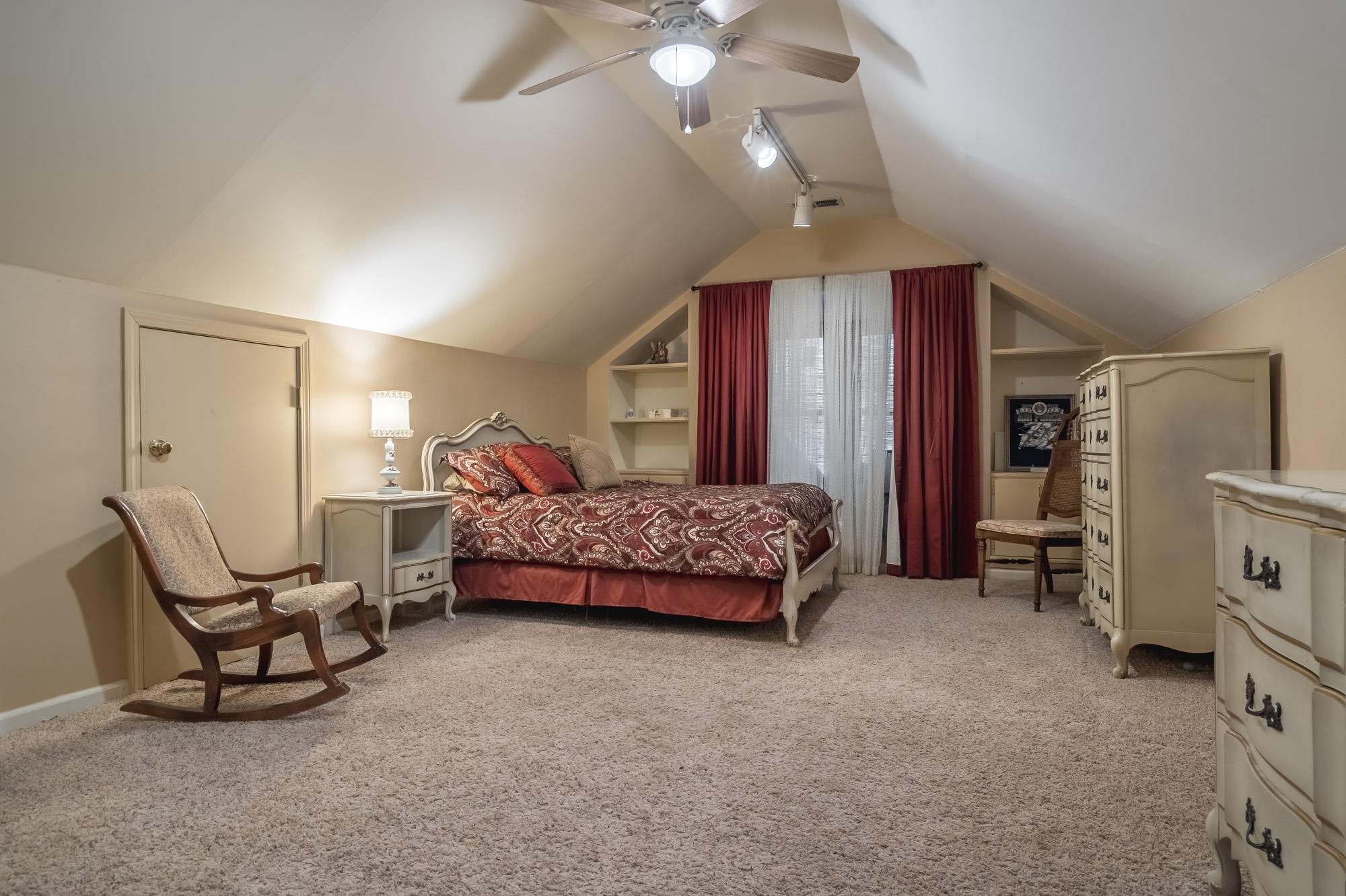 132 South Walnut Bend Road Memphis, TN 38018 - Photo 17 of 23 a bedroom with a bed a chair and piano
