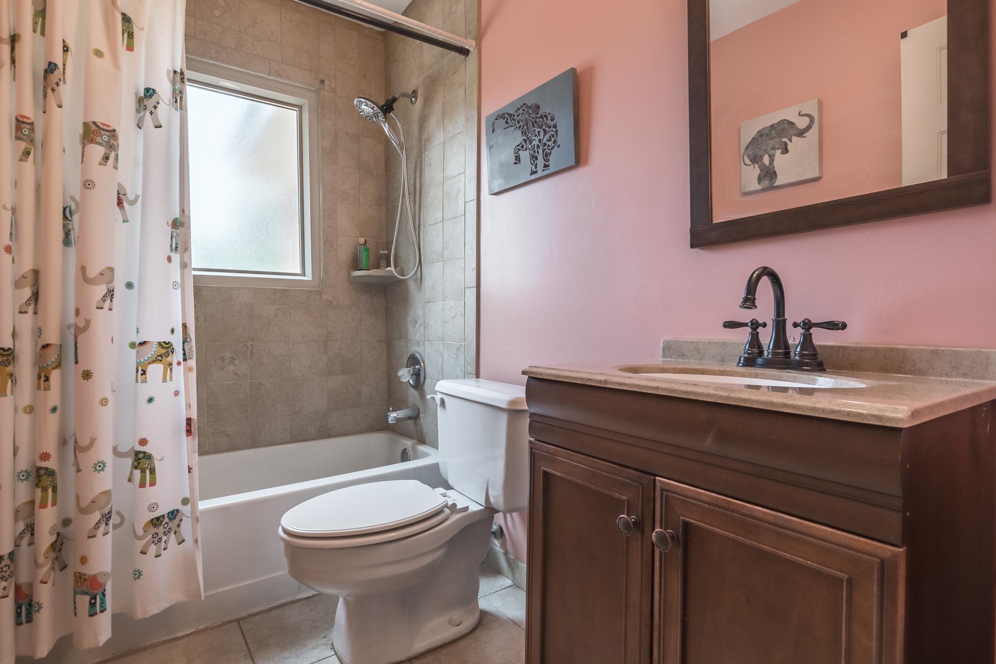 132 South Walnut Bend Road Memphis, TN 38018 - Photo 18 of 23 a bathroom with a toilet a sink and mirror