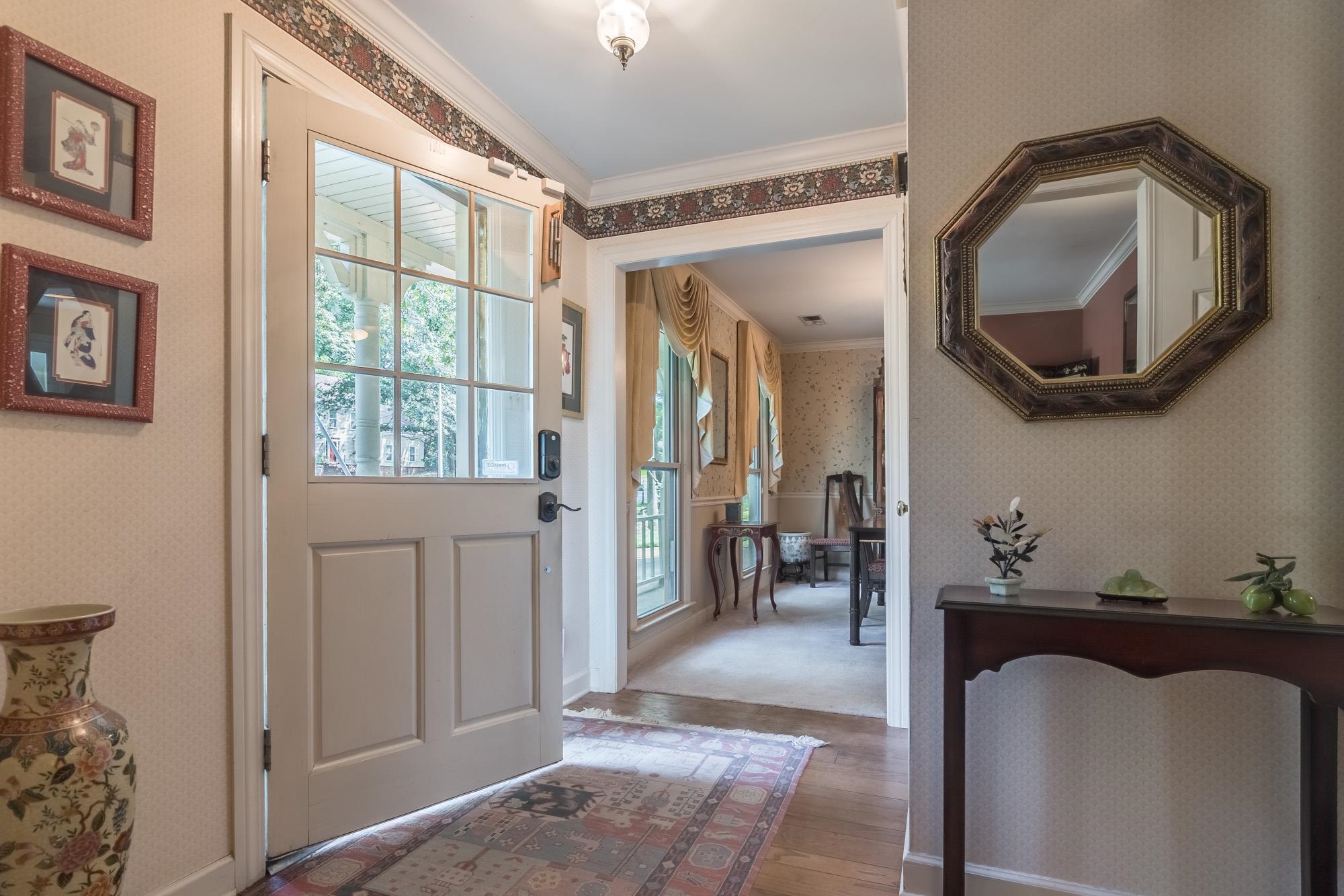 132 South Walnut Bend Road Memphis, TN 38018 - Photo 2 of 23 a hall way with furniture a mirror and a window
