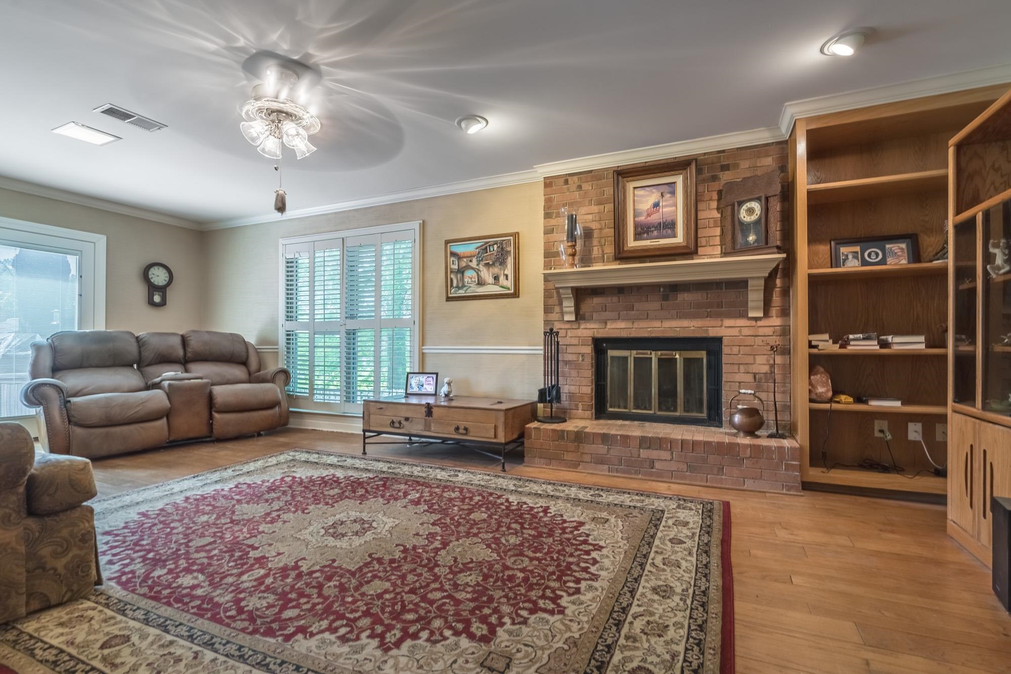 132 South Walnut Bend Road Memphis, TN 38018 - Photo 5 of 23 a living room with furniture and a fireplace