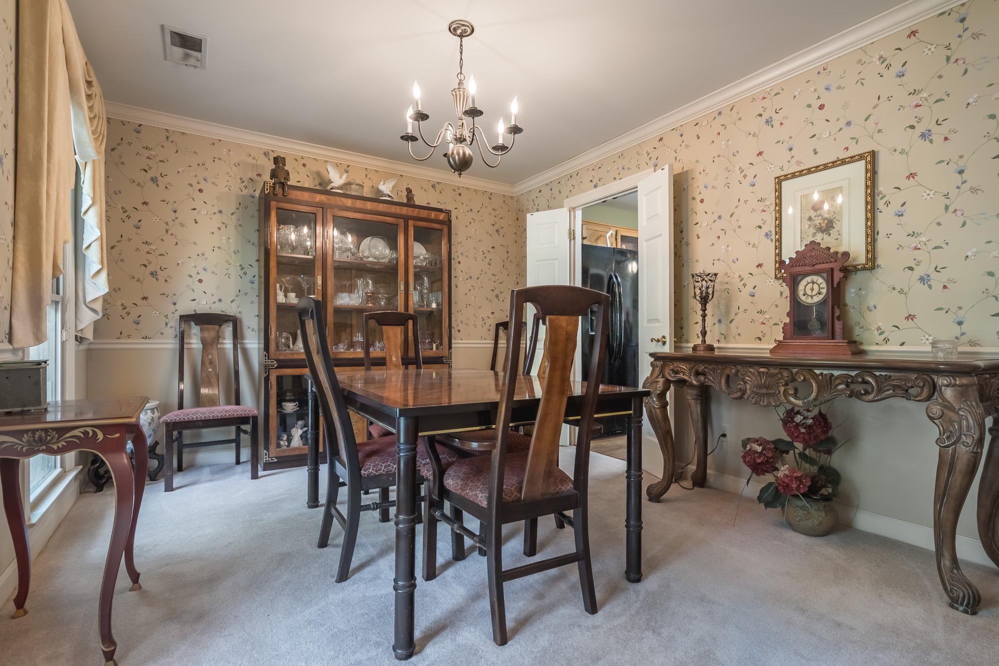 132 South Walnut Bend Road Memphis, TN 38018 - Photo 6 of 23 a view of a dining room with furniture and a chandelier