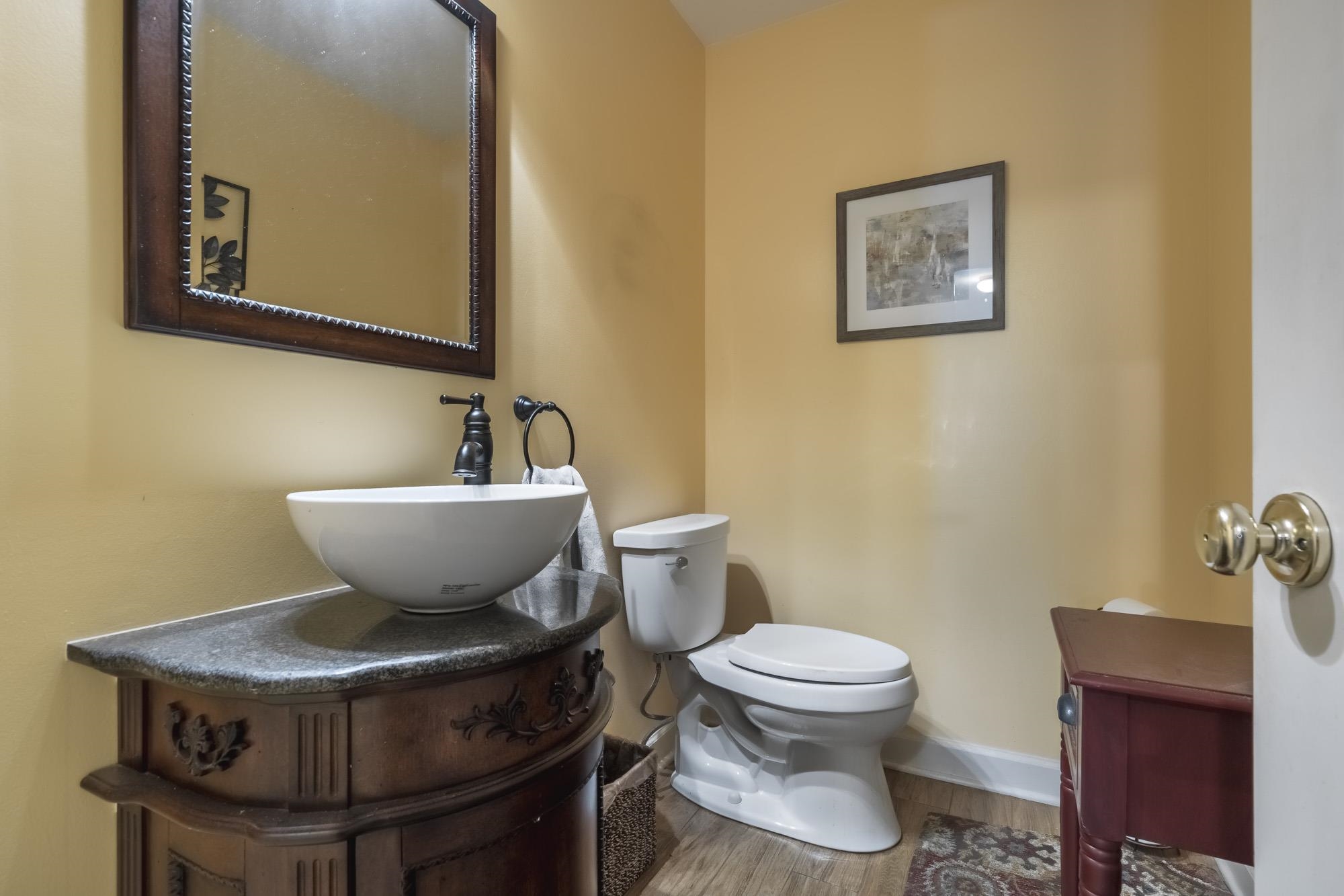 132 South Walnut Bend Road Memphis, TN 38018 - Photo 7 of 23 a bathroom with a toilet and a sink
