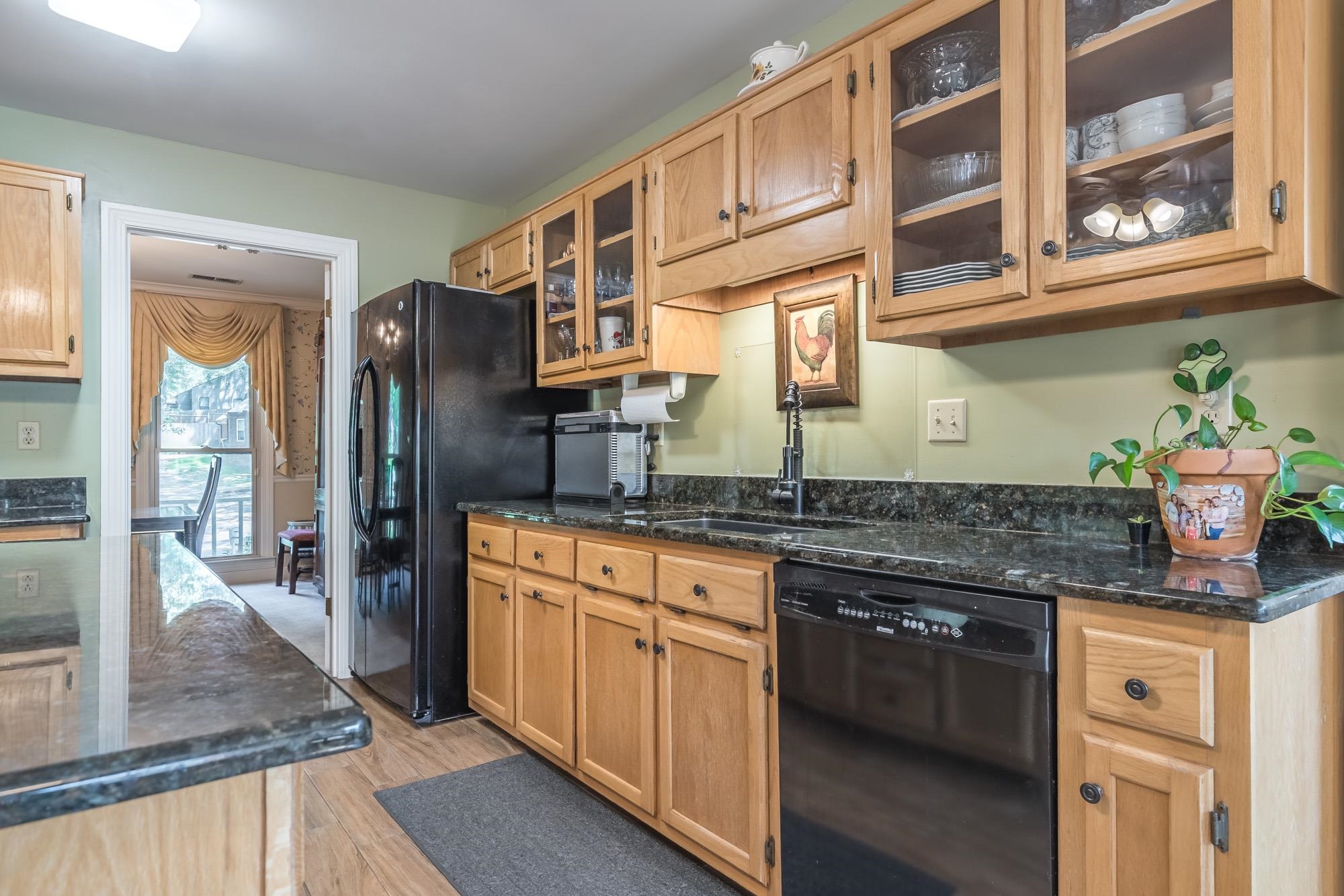 132 South Walnut Bend Road Memphis, TN 38018 - Photo 9 of 23 a kitchen with stainless steel appliances granite countertop a stove and cabinets