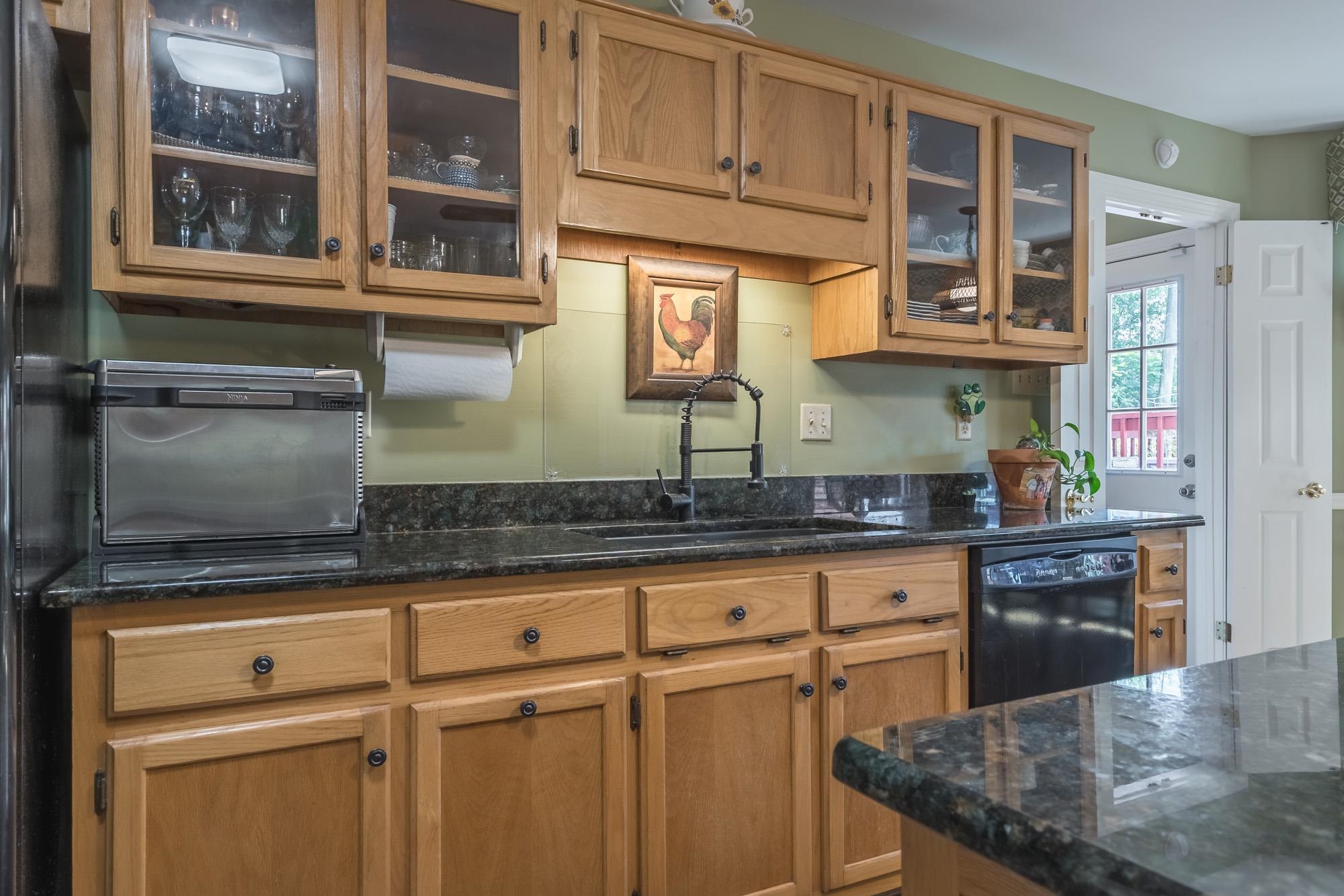 132 South Walnut Bend Road Memphis, TN 38018 - Photo 10 of 23 a kitchen with stainless steel appliances granite countertop a sink and a granite counter tops