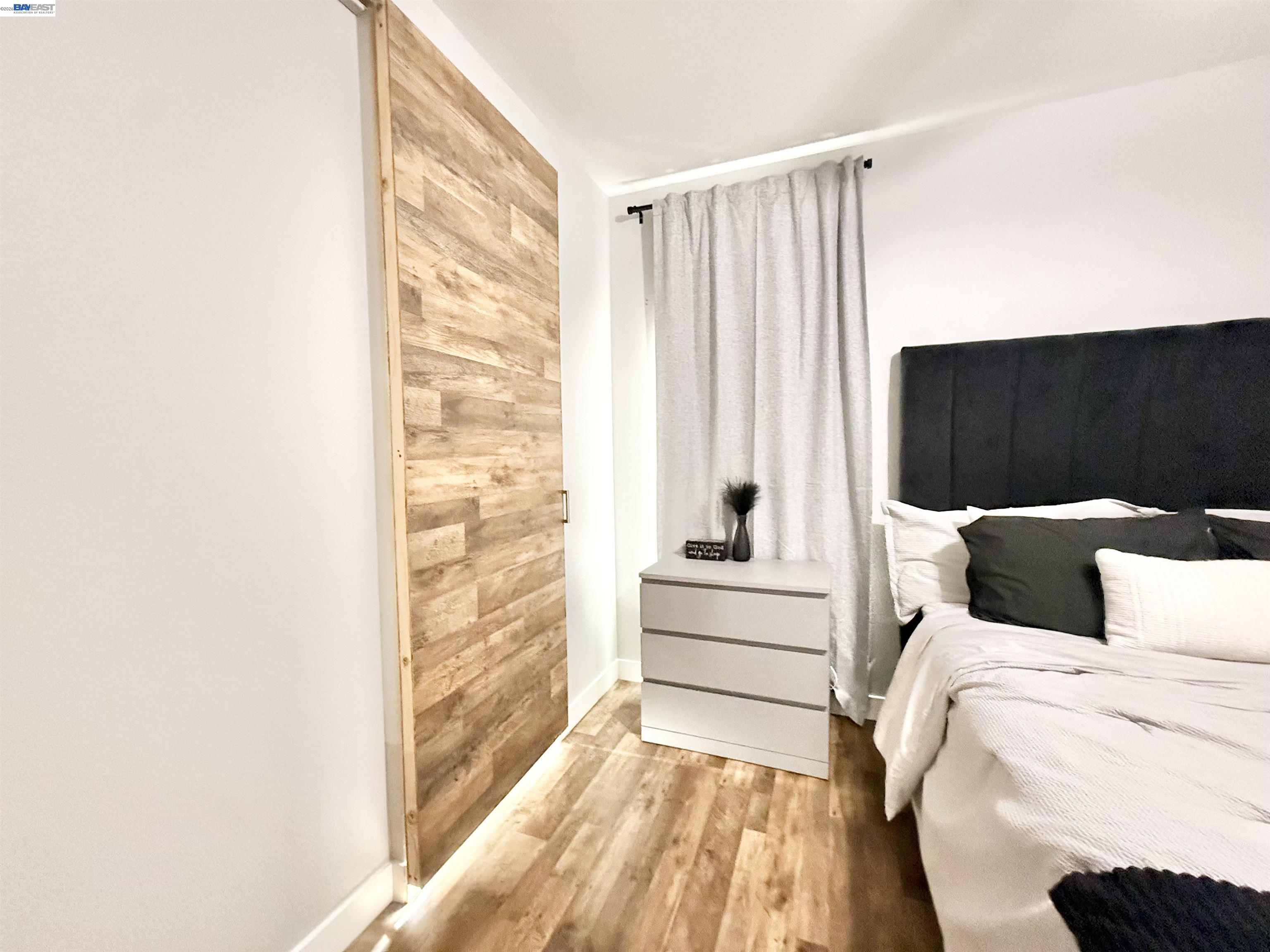 2408 Mountain Pride Court Modesto, CA 95355 - Photo 12 of 25 a view of a bedroom with a bed and a window