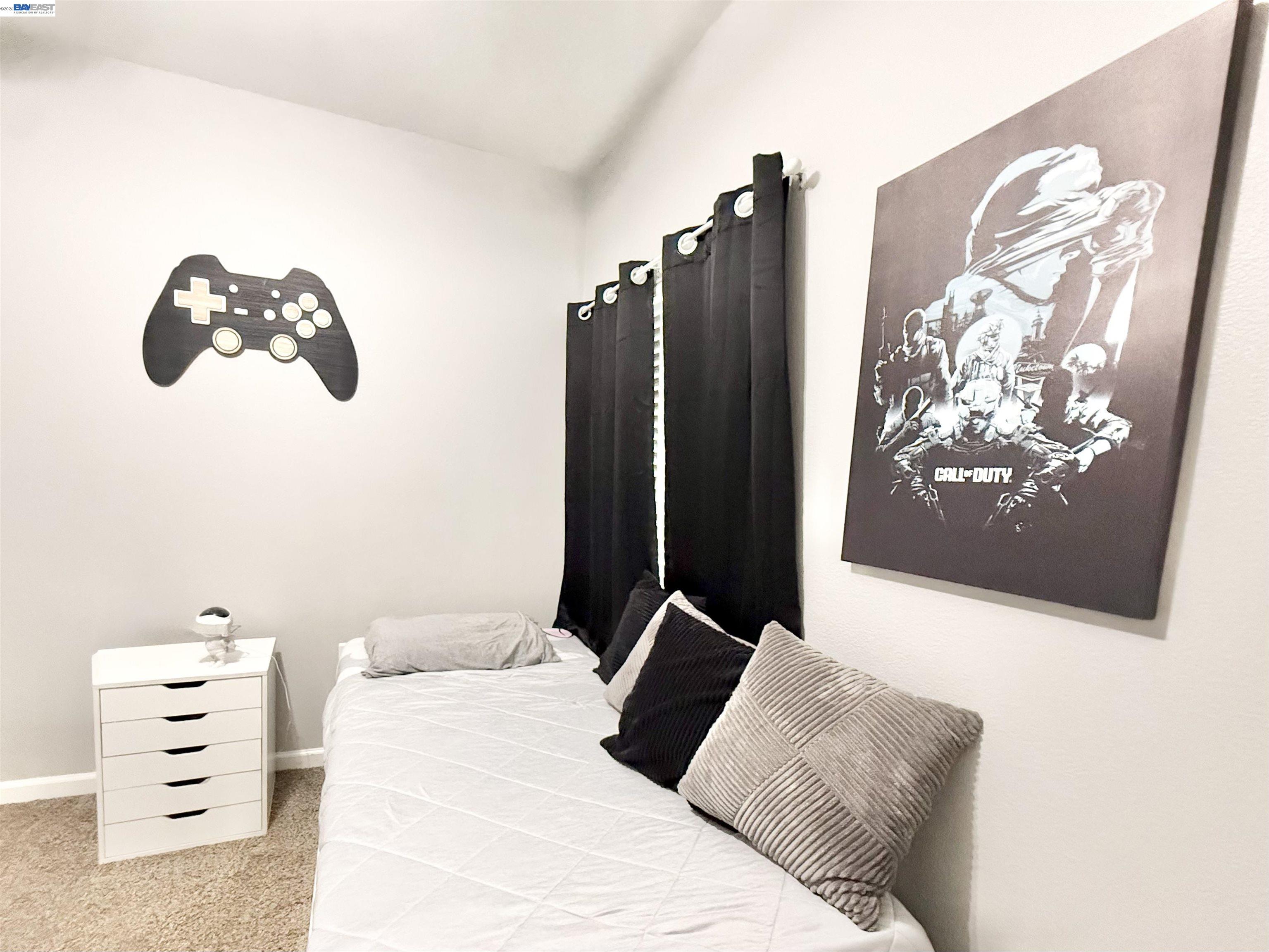 2408 Mountain Pride Court Modesto, CA 95355 - Photo 15 of 25 a bedroom with a bed and a painting on the wall